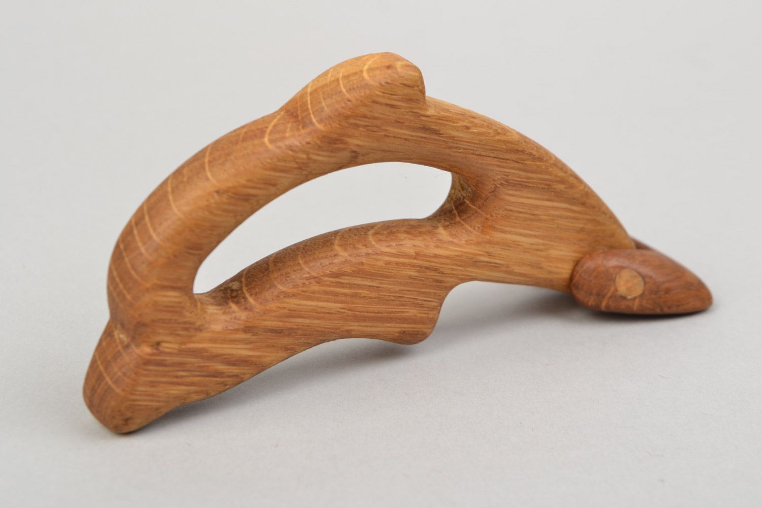Handmade wooden teething toy in the shape of dolphin imbued with linseed oil photo 3