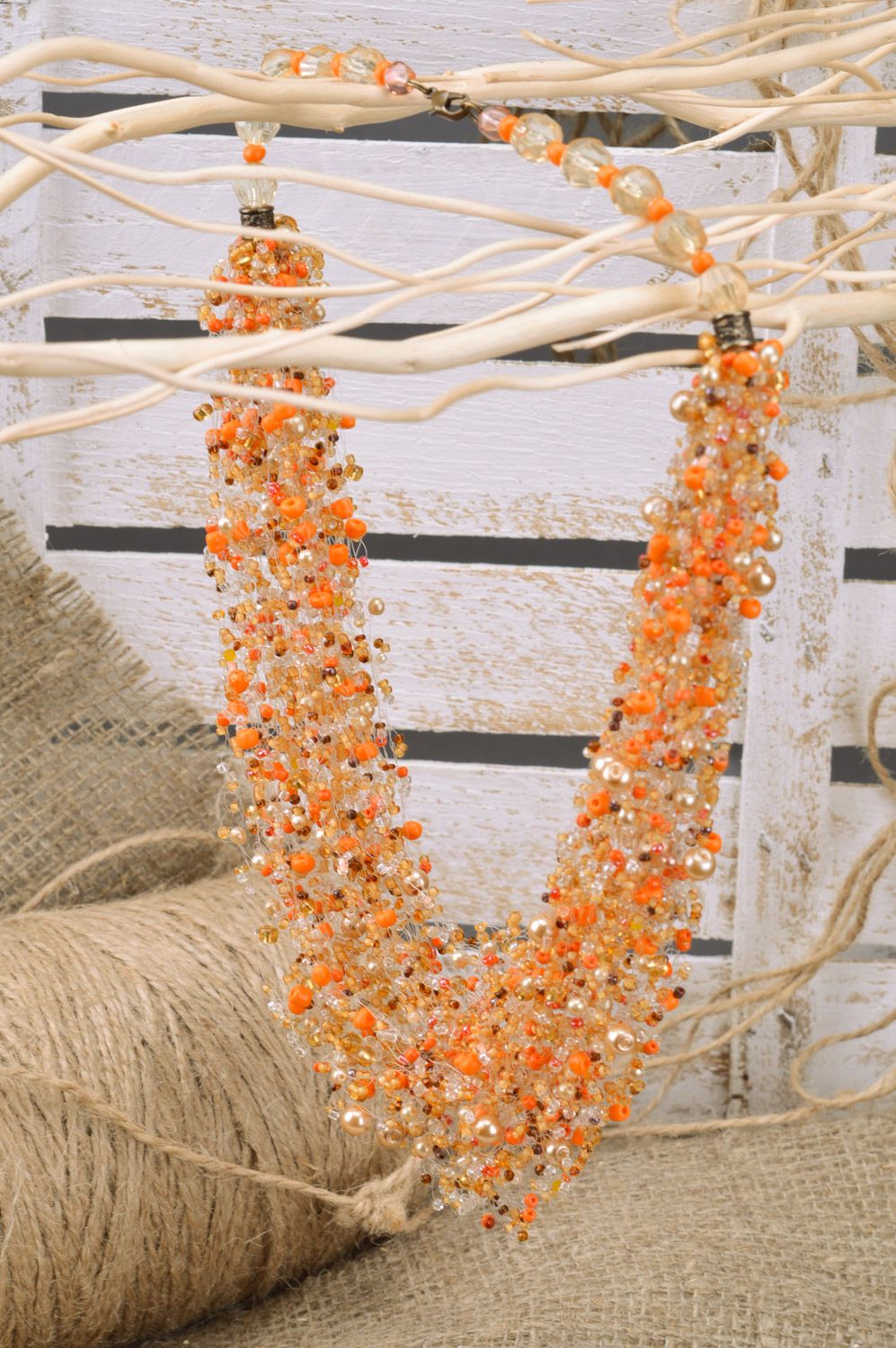 Unusual handmade long airy beaded necklace of orange color photo 1