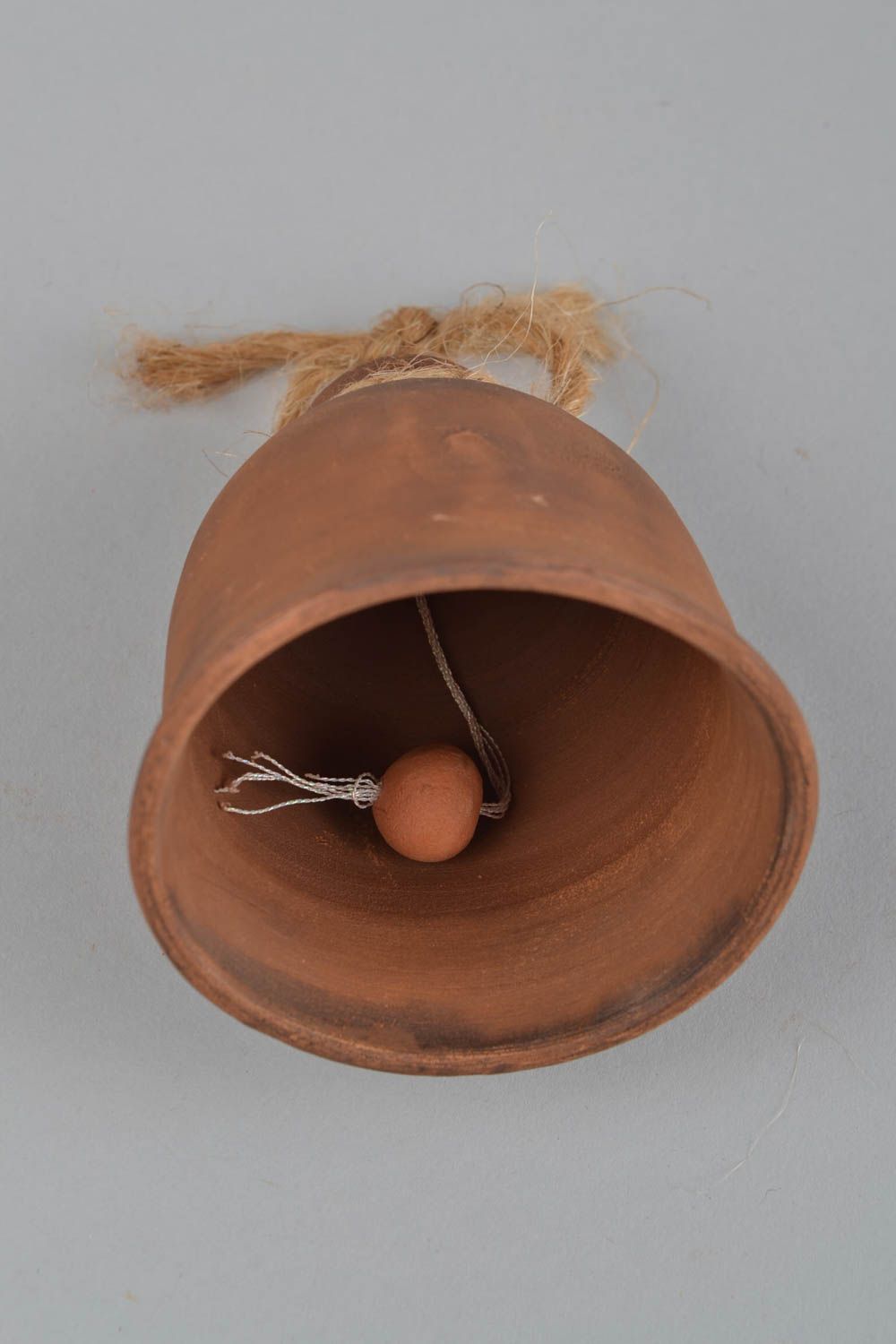 Handmade small simple brown ceramic hanging bell in ethnic style on cord photo 4