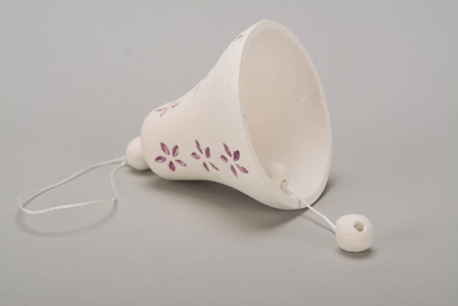 Bell made from white clay photo 1