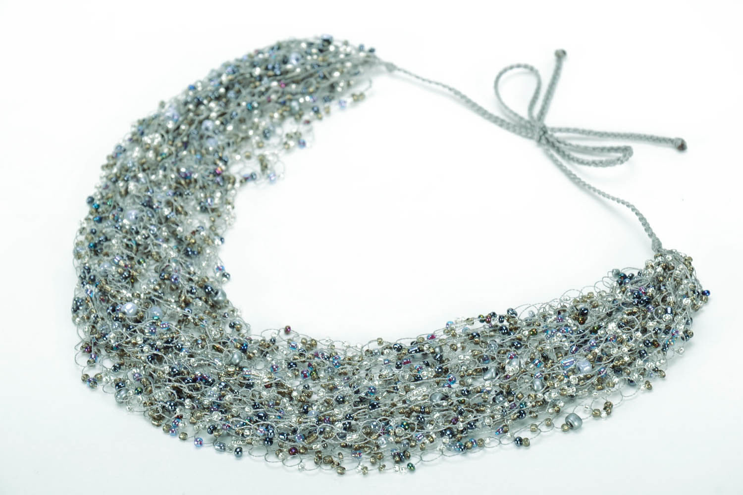 Gray necklace made of beads  photo 1