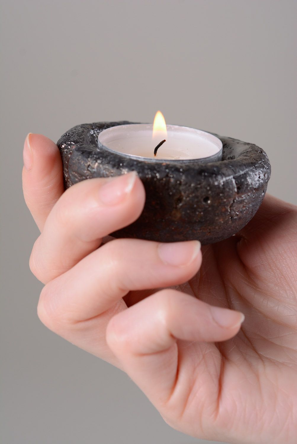 Small handmade round clay candle holder of dark color photo 3