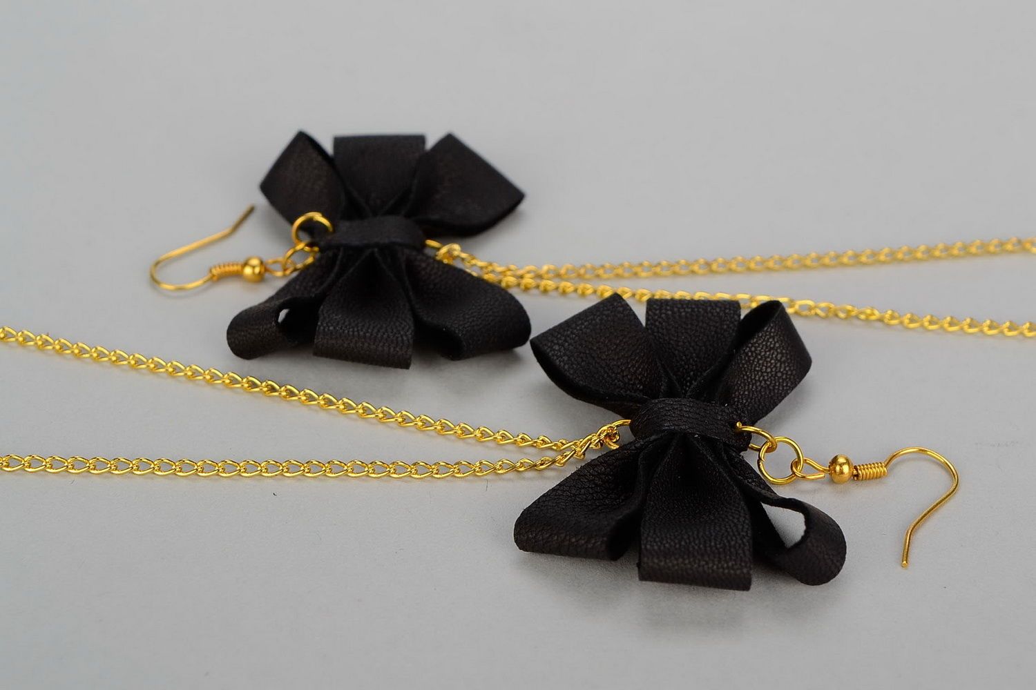 Leather earrings with gilt metal Bows photo 2