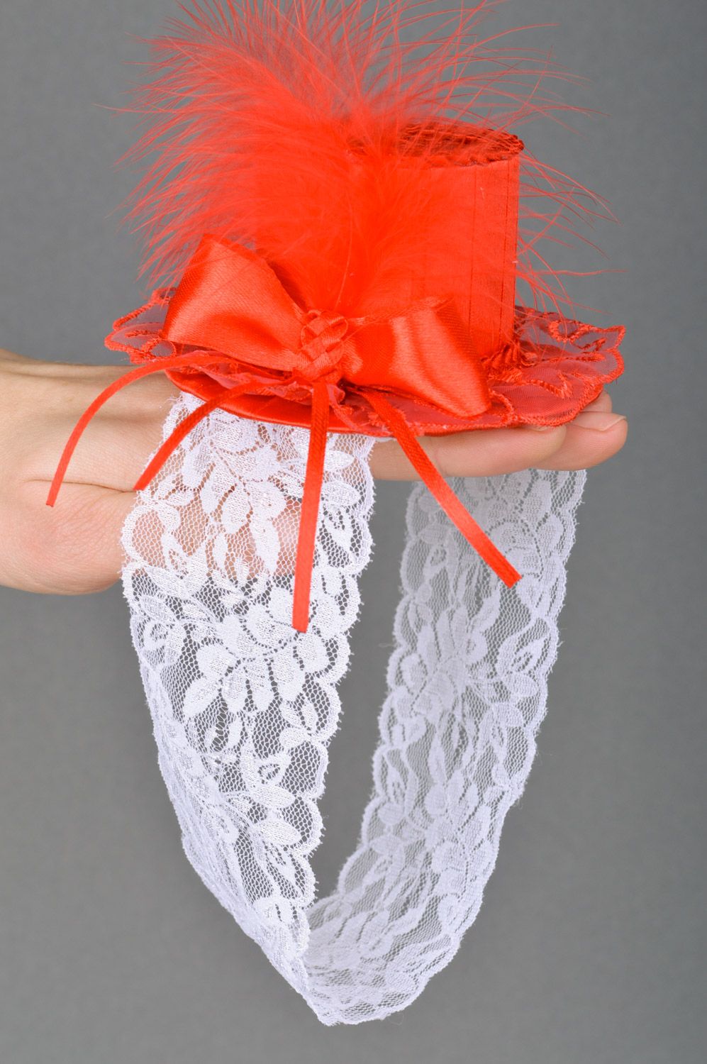Handmade decorative white lacy headband with red satin top hat with feathers photo 2