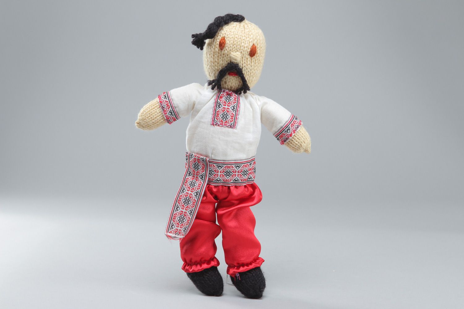 Handmade acrylic knit soft toy Cossack in embroidered shirt and bloomers photo 1
