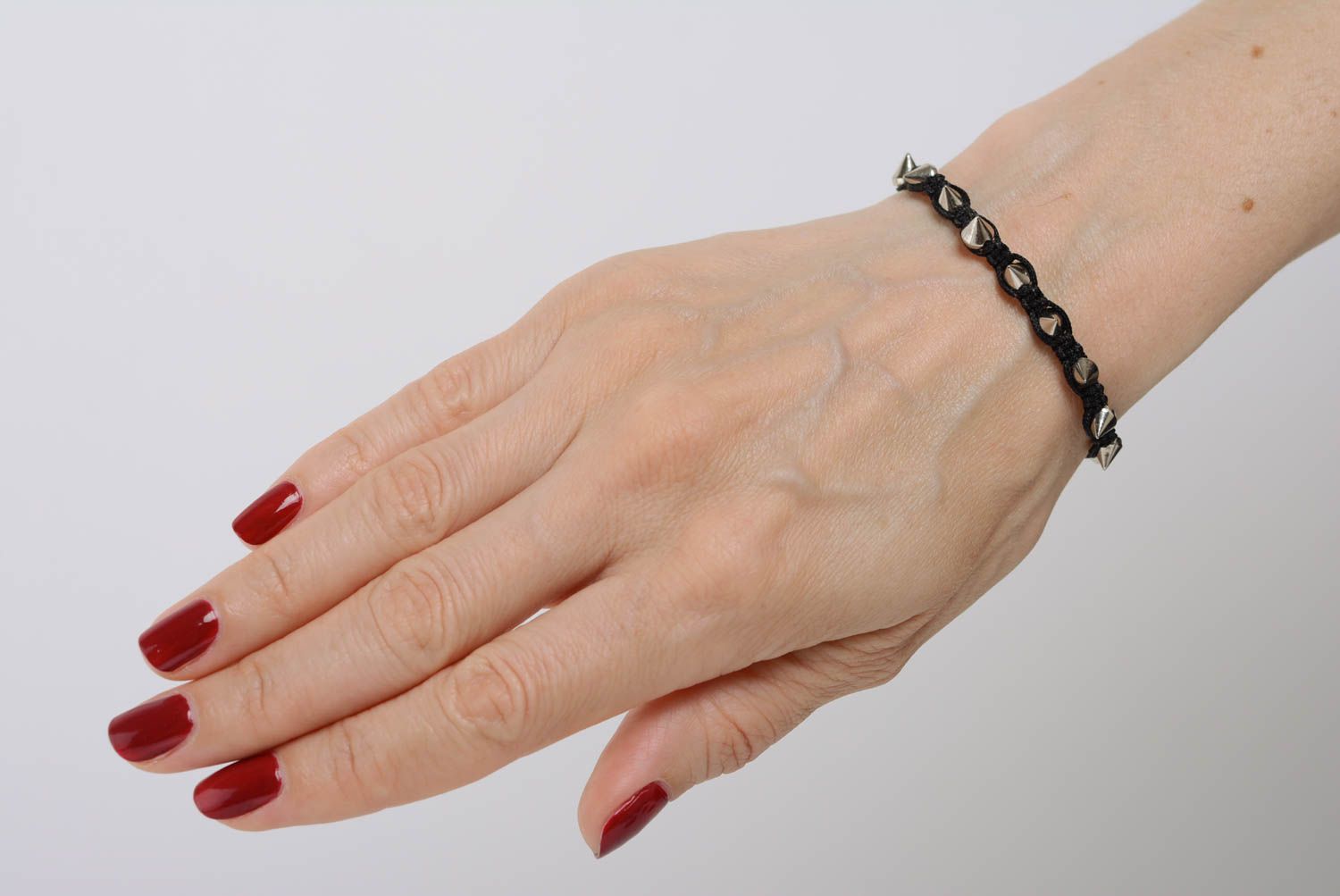 Beautiful black handmade thin macrame woven cord bracelet with metal studs photo 3