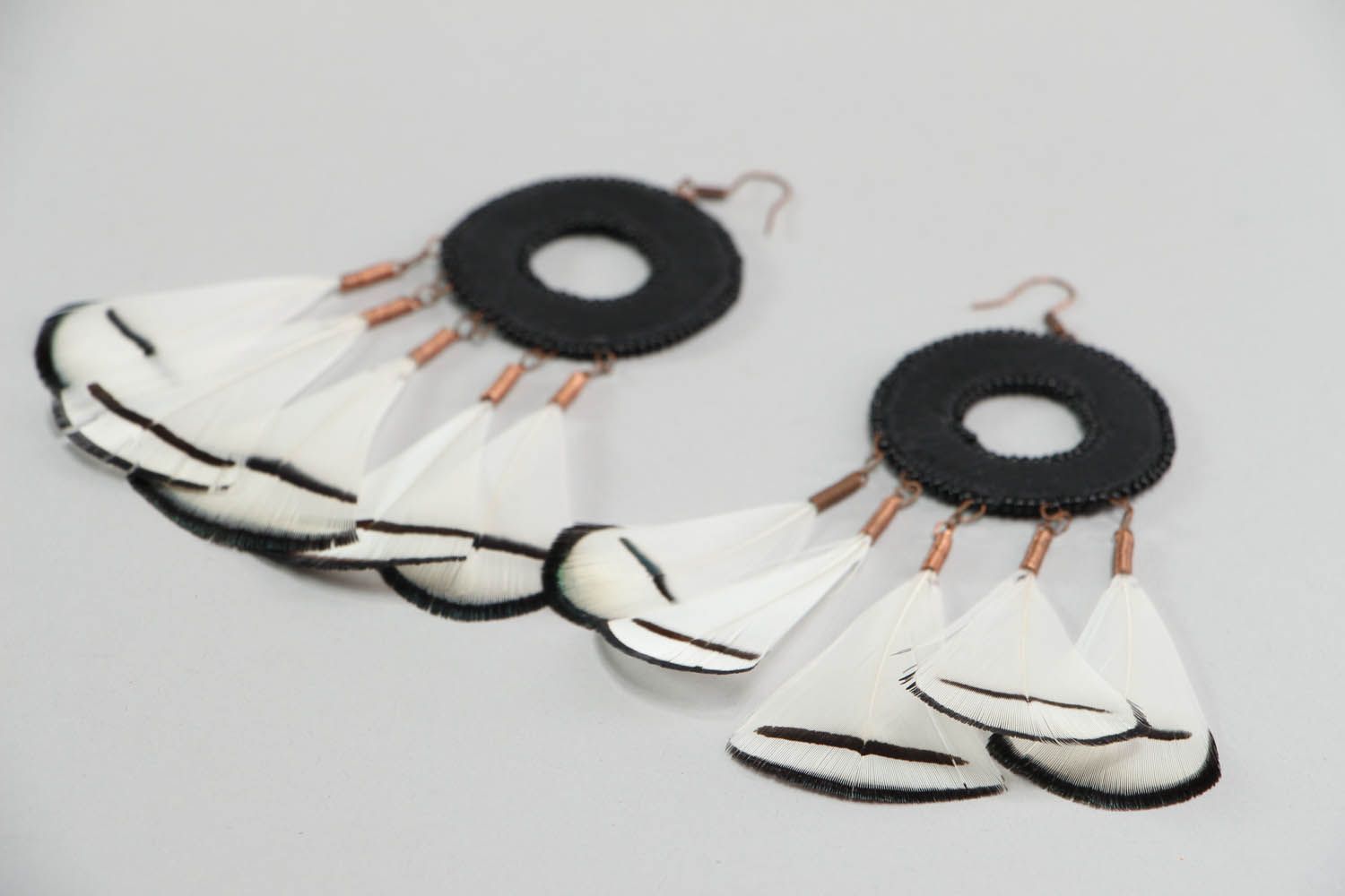 Earrings made of leather and feathers photo 2