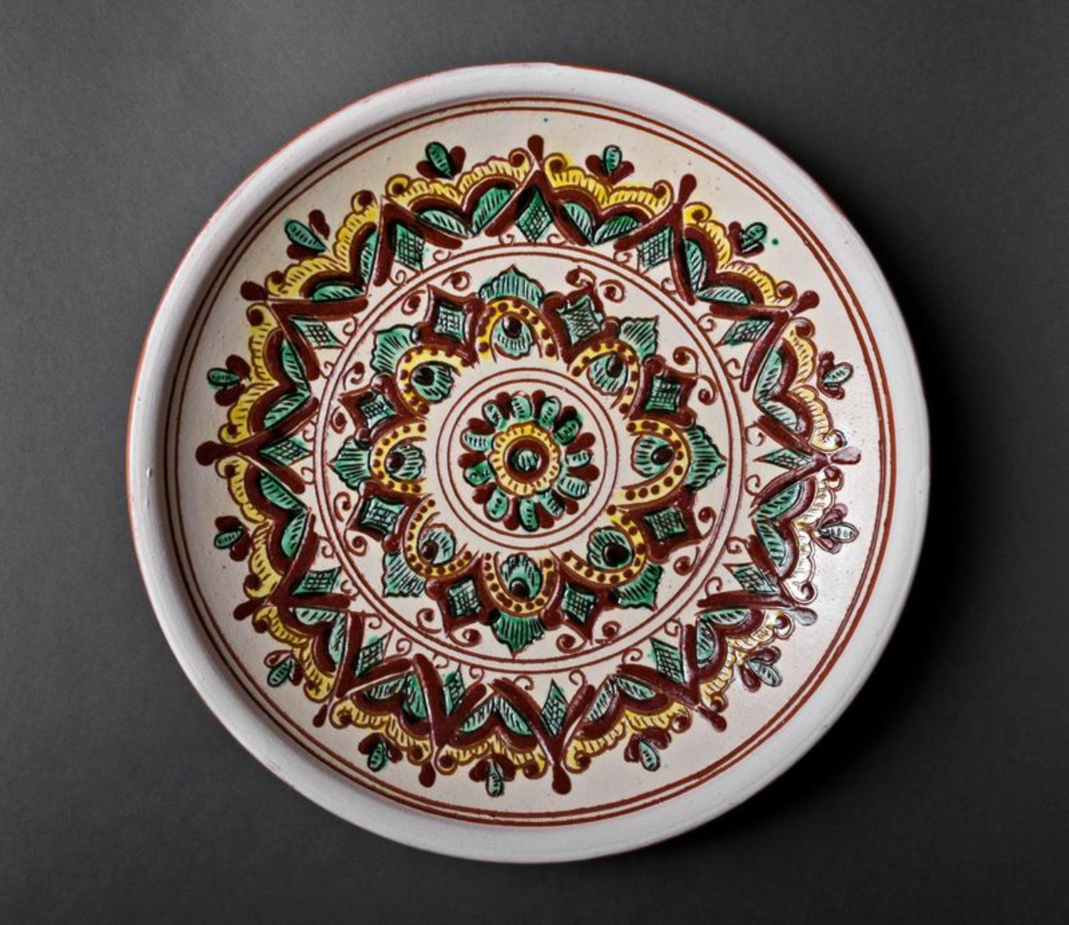 Decorative ceramic plate with pattern photo 4
