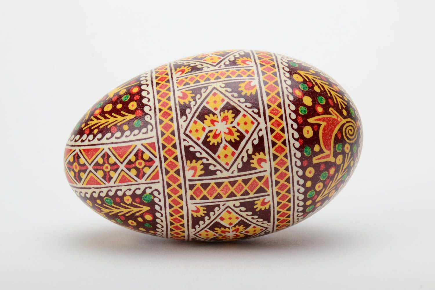 Handmade colorful decorative Easter pysanka goose egg with wax painting photo 3