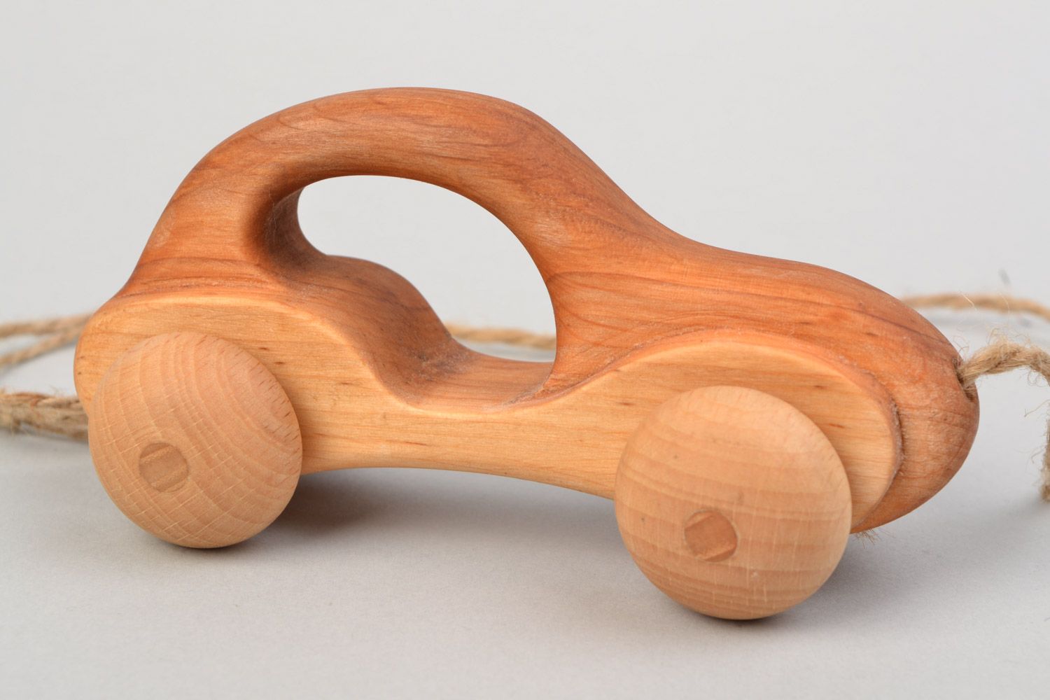 Handmade children's wooden wheeled toy car imbued with linseed oil photo 3