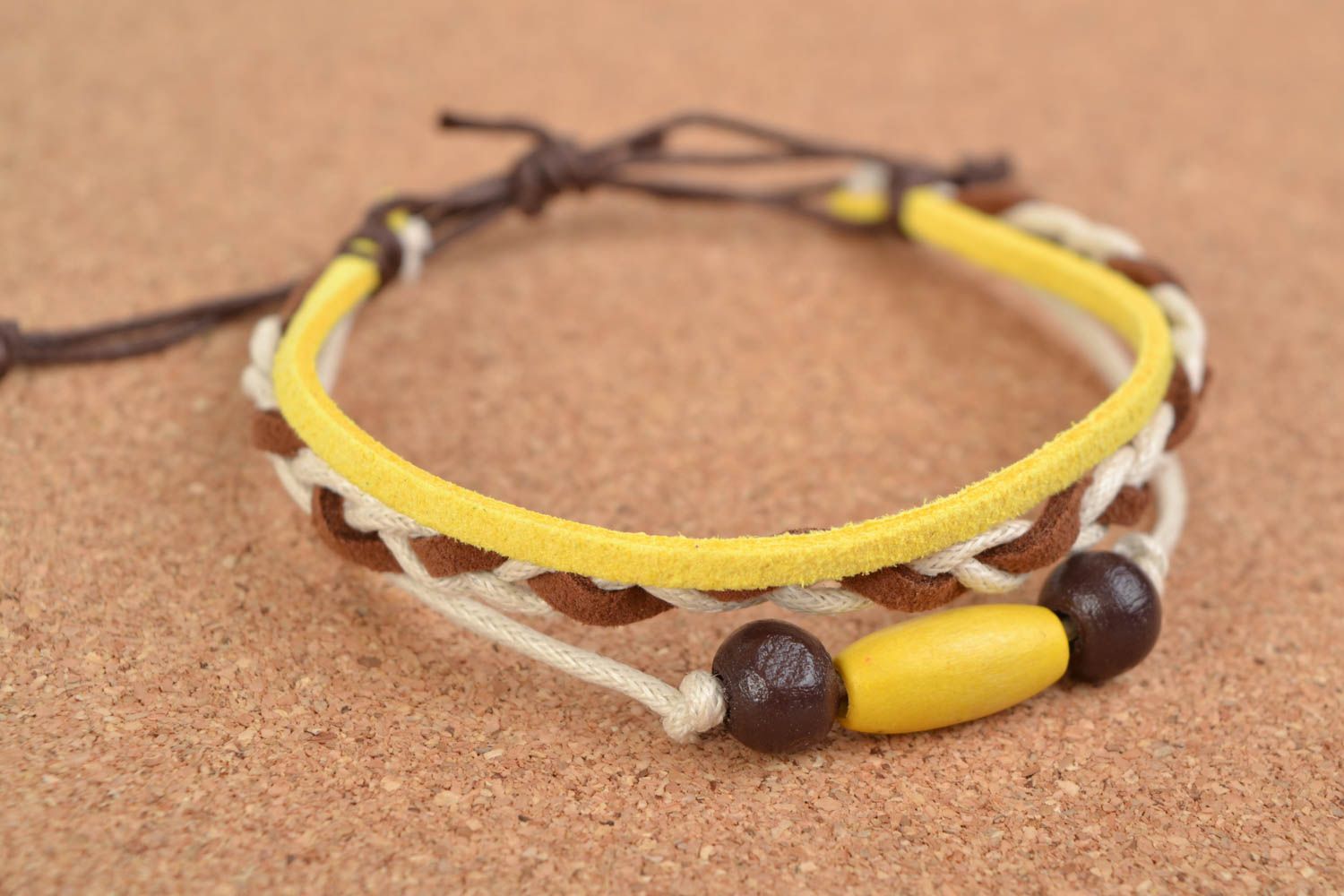 Handmade woven cotton cord wrist bracelet with wooden beads photo 1
