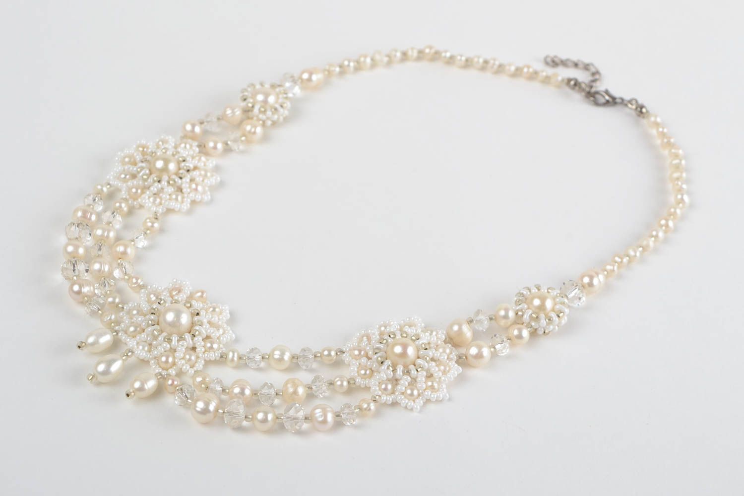 Beautiful festive handmade white necklace made of beads and natural stones photo 4