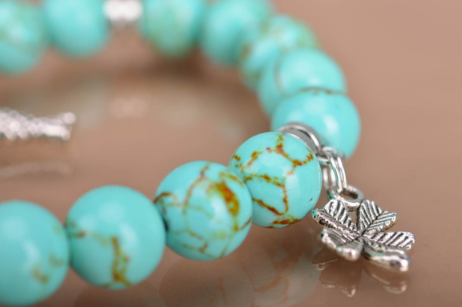 Handmade beaded wrist bracelet styled on turquoise with metal charms fish leaves photo 5