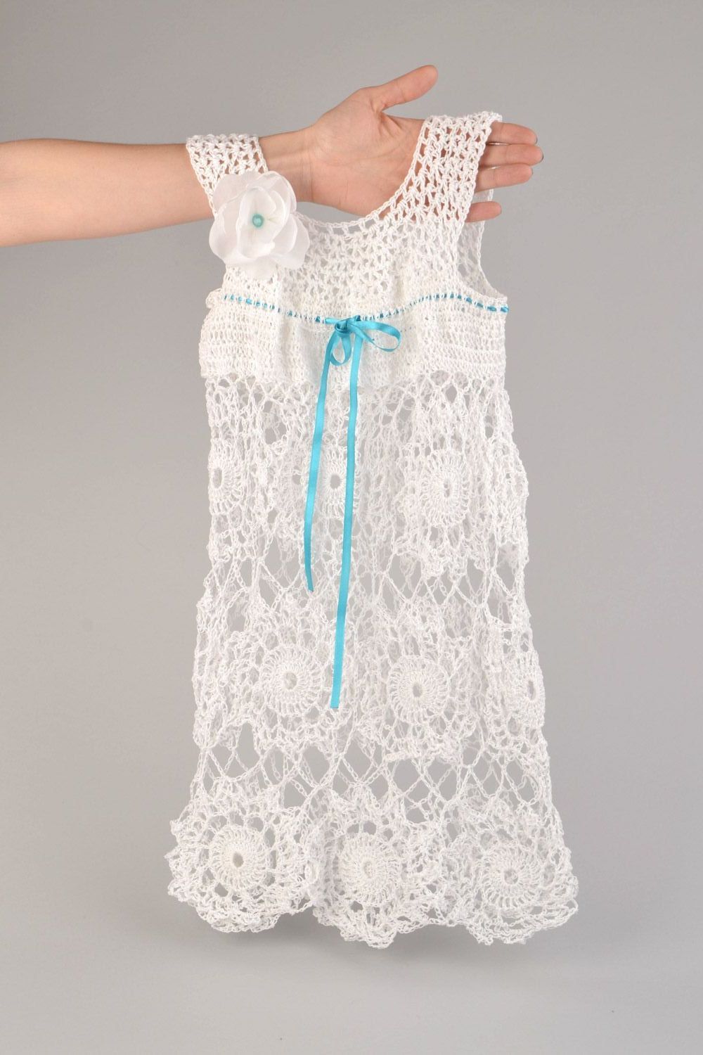 Handmade  elegant openwork crochet baby dress of white color made of acrylic yarns photo 1