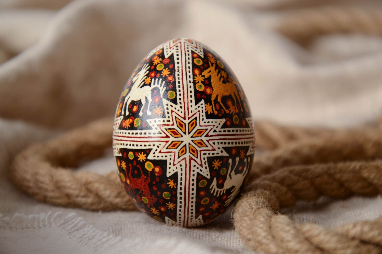 Festive handmade painted Easter egg with special symbol waxing technique photo 1