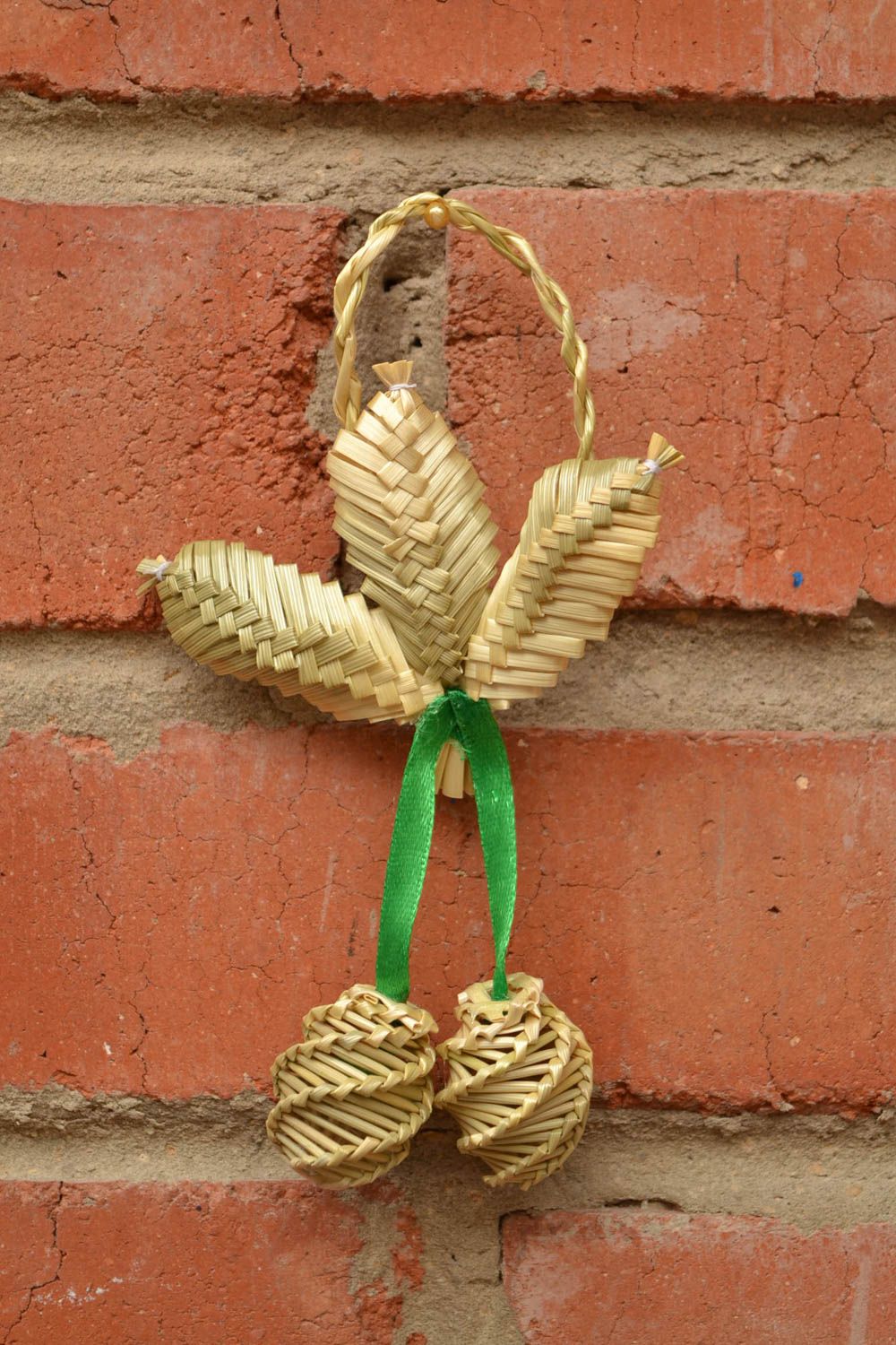 Handmade ethnic interior wall hanging woven of straw with green ribbon photo 1