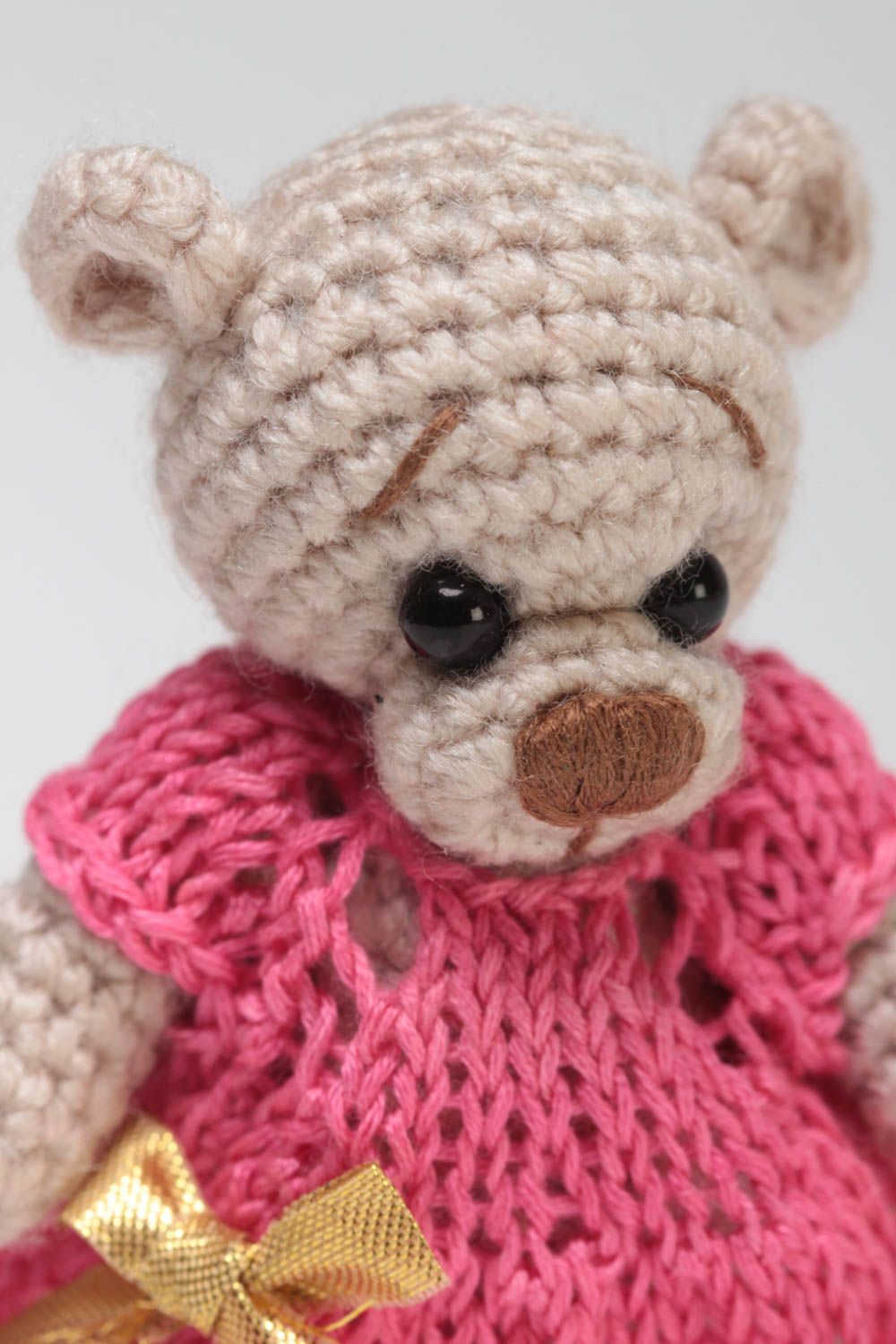 Small handmade beige soft toy bear in pink dress crocheted of acrylic threads  photo 3