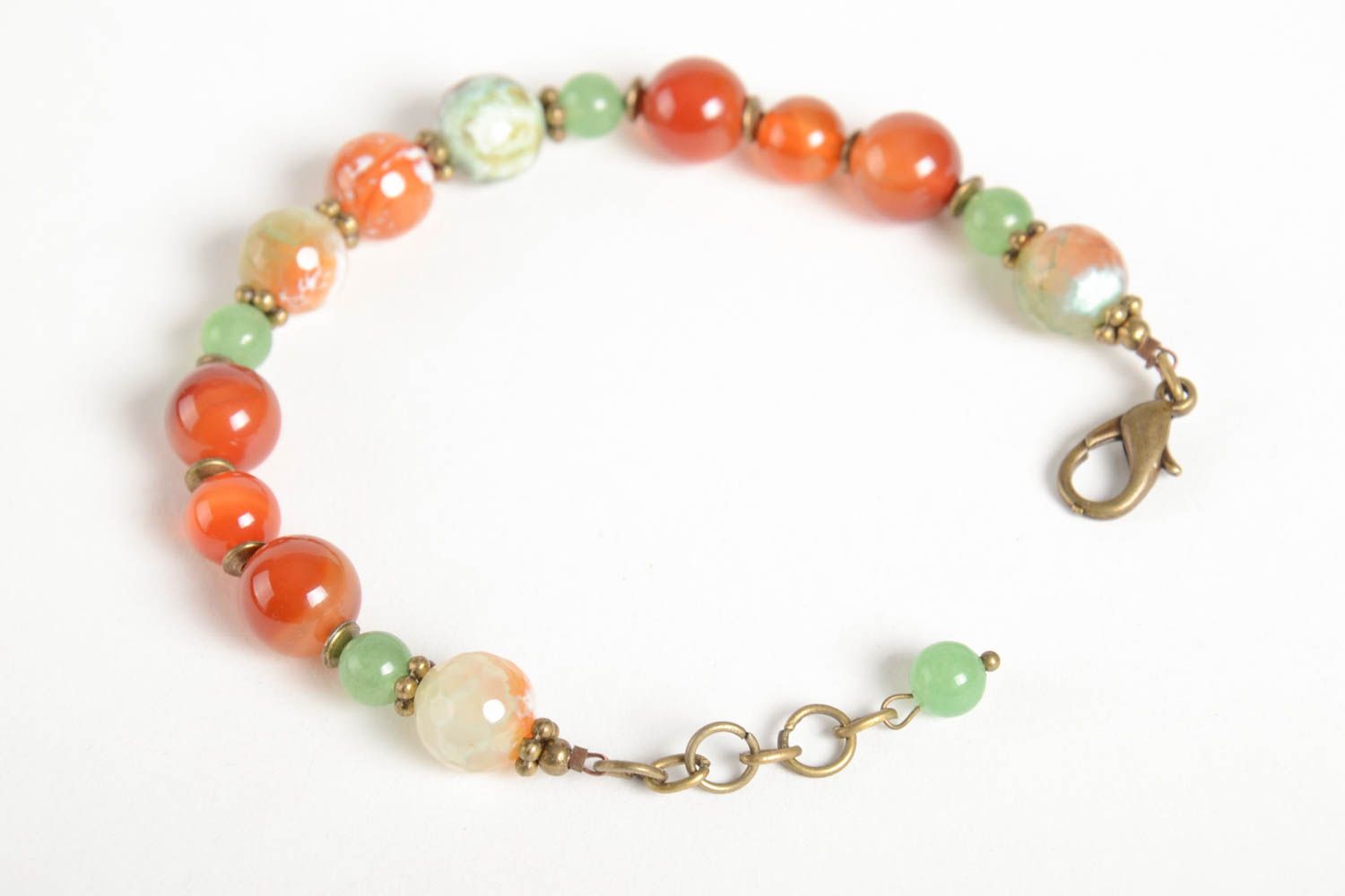 Stylish handmade gemstone beaded adjustable bracelet in pale green and orange color photo 3