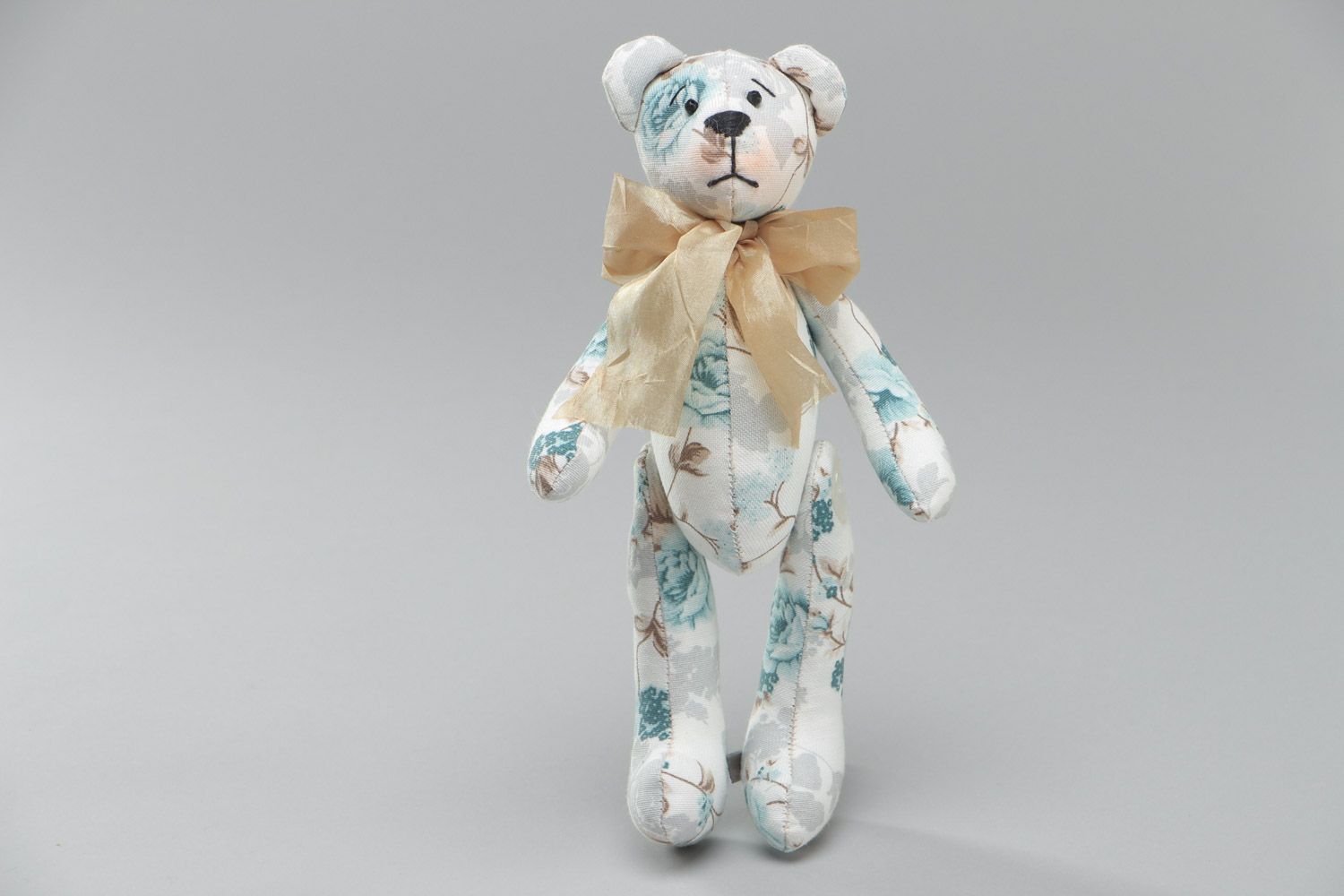 Handmade cute soft toy sewn of cotton Bear with bow in tender color palette photo 2
