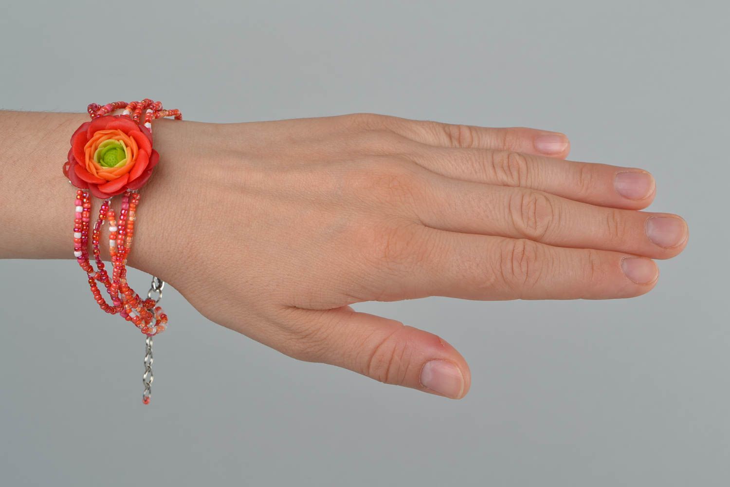 Handmade women's designer beaded wrist bracelet with red polymer clay flower photo 3