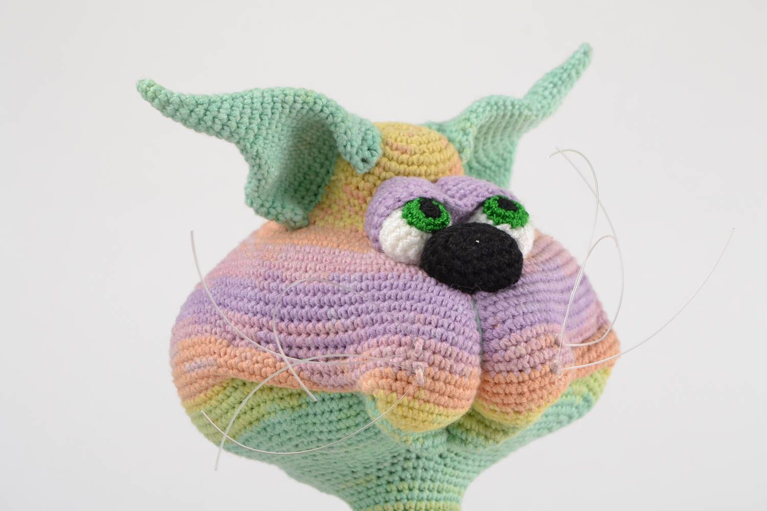 Handmade designer soft toy crocheted of acrylic threads cat of rainbow coloring photo 4
