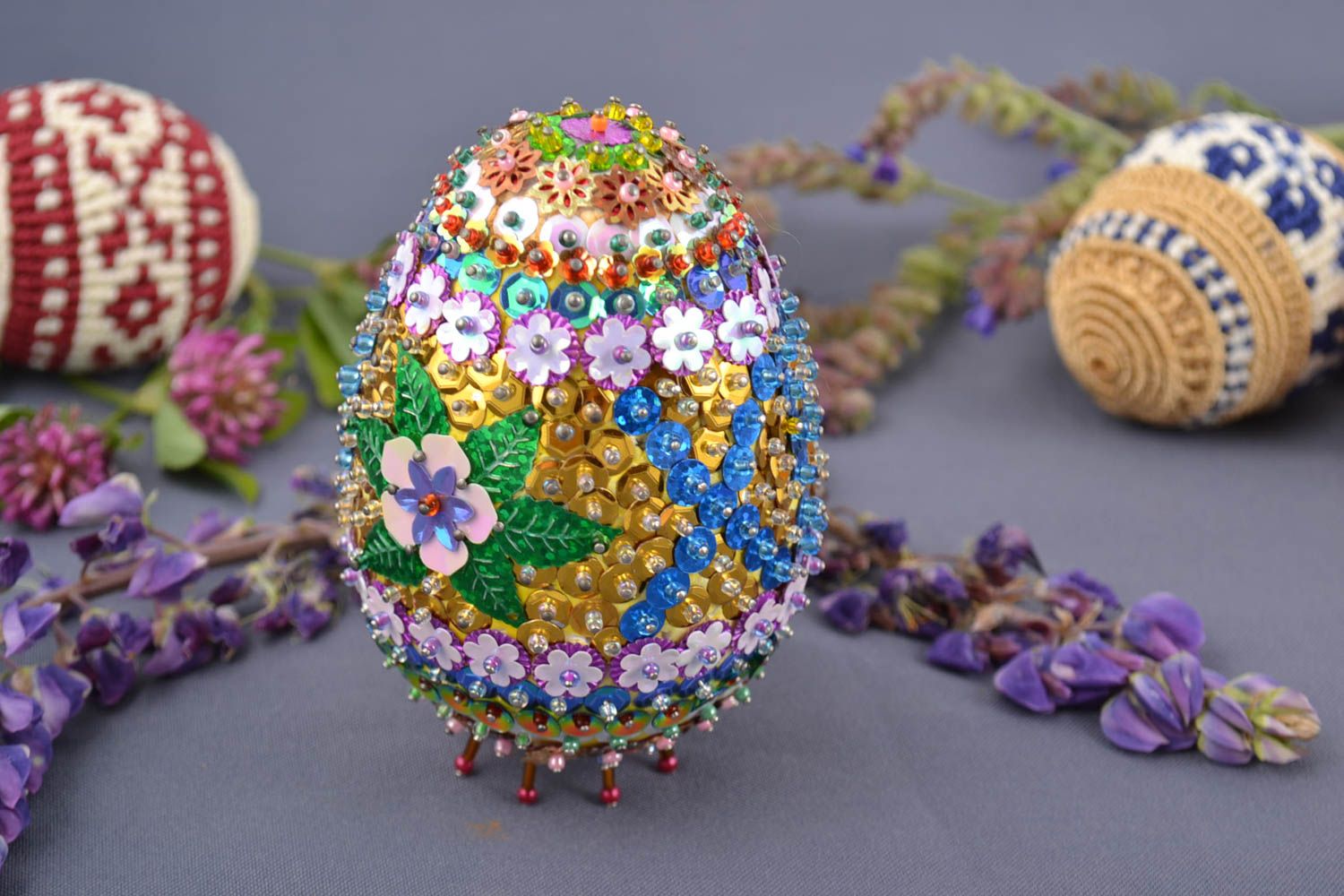 Handmade decorative colorful Easter egg embroidered with beads and spangles photo 1