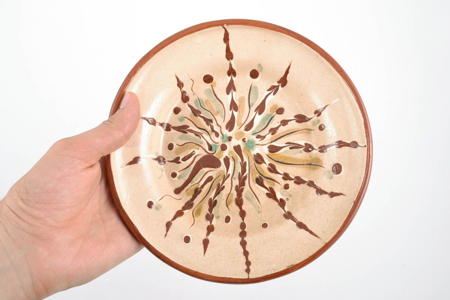 Handmade decorative round ceramic plate painted with glaze photo 2