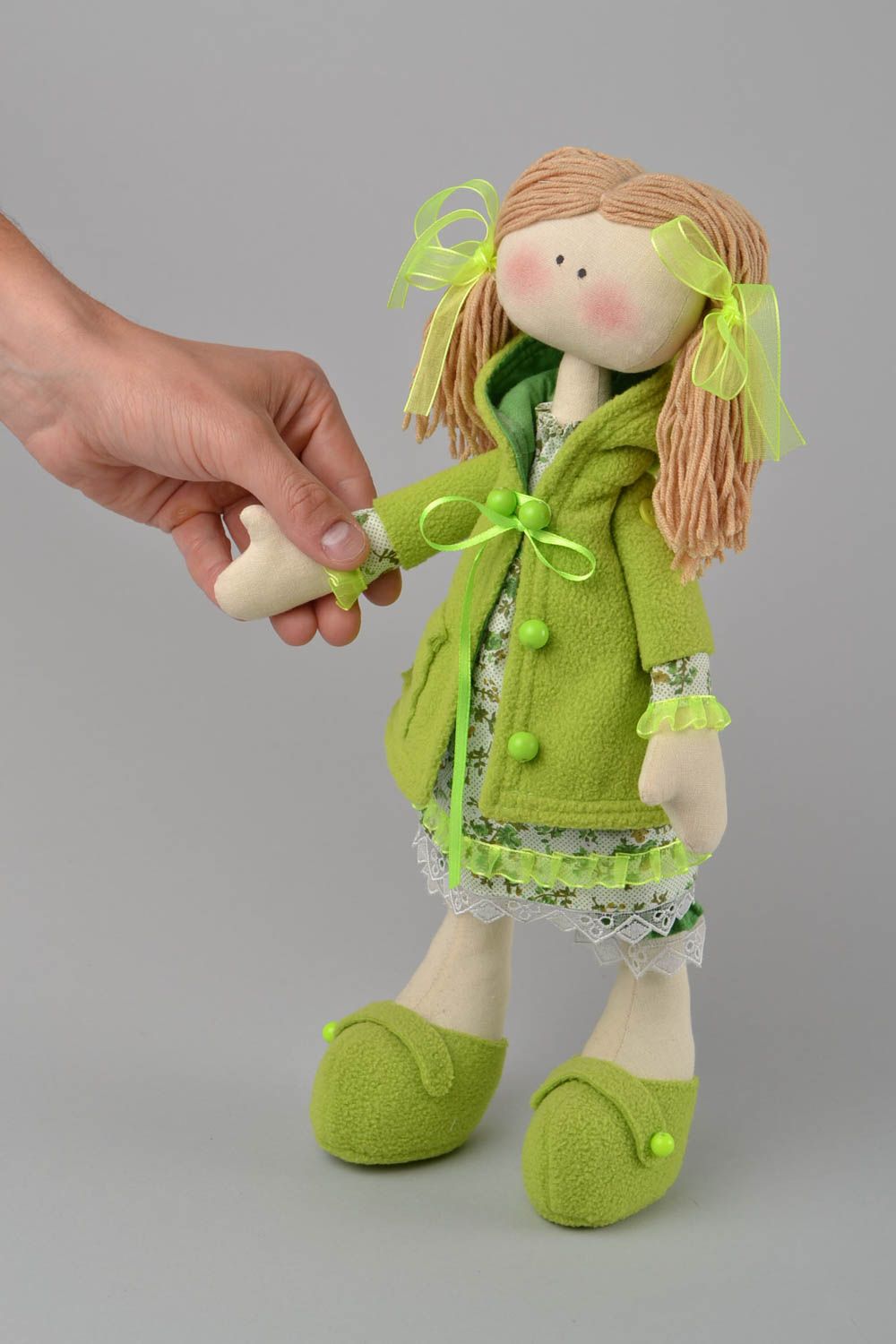 Handmade designer fabric soft doll girl in green clothing with pig tails photo 2