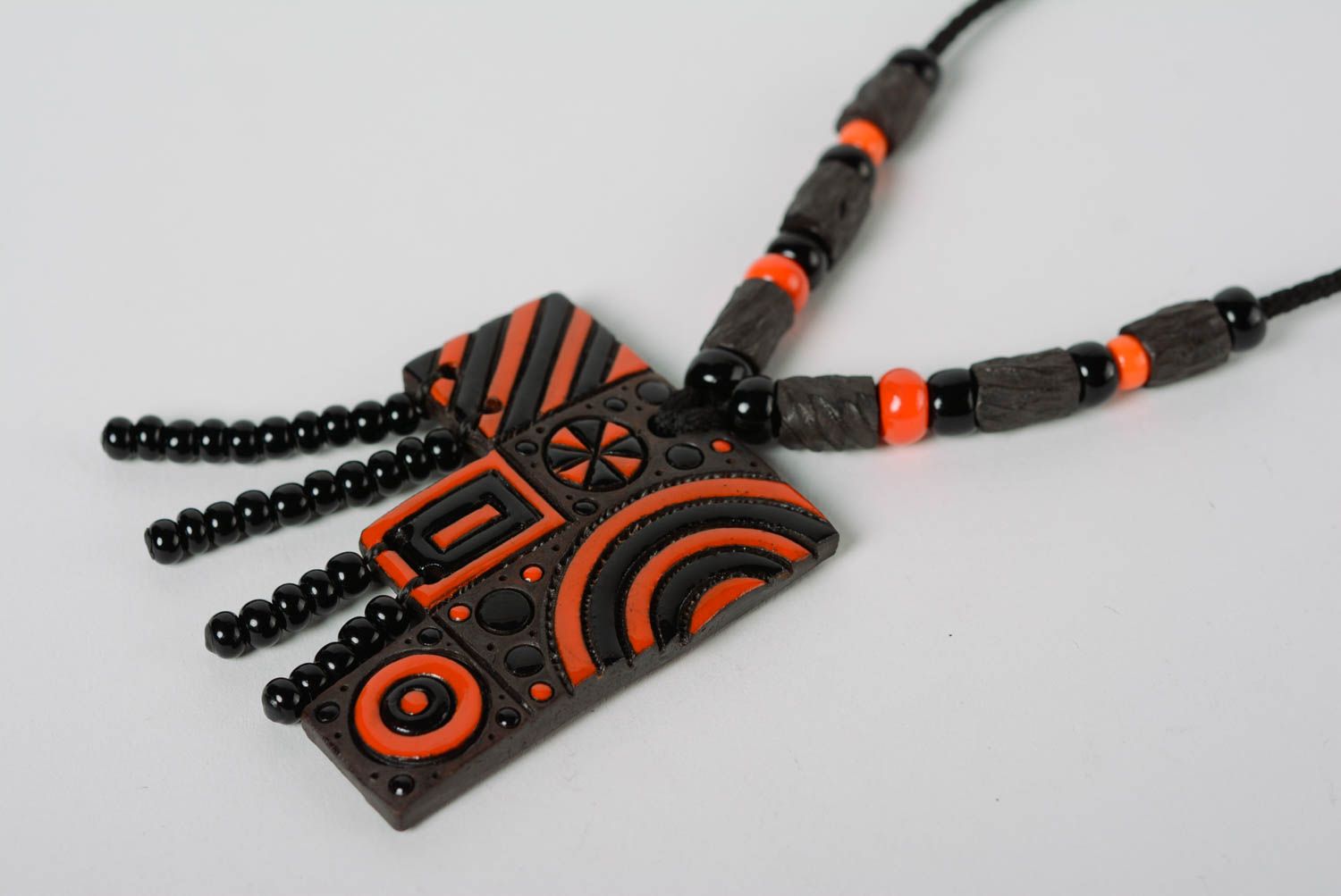 Handmade designer clay pendant painted with enamel and equipped with cord and beads photo 2