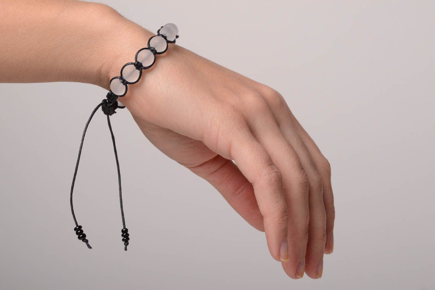 Transparent beads strand bracelet with black cord photo 2