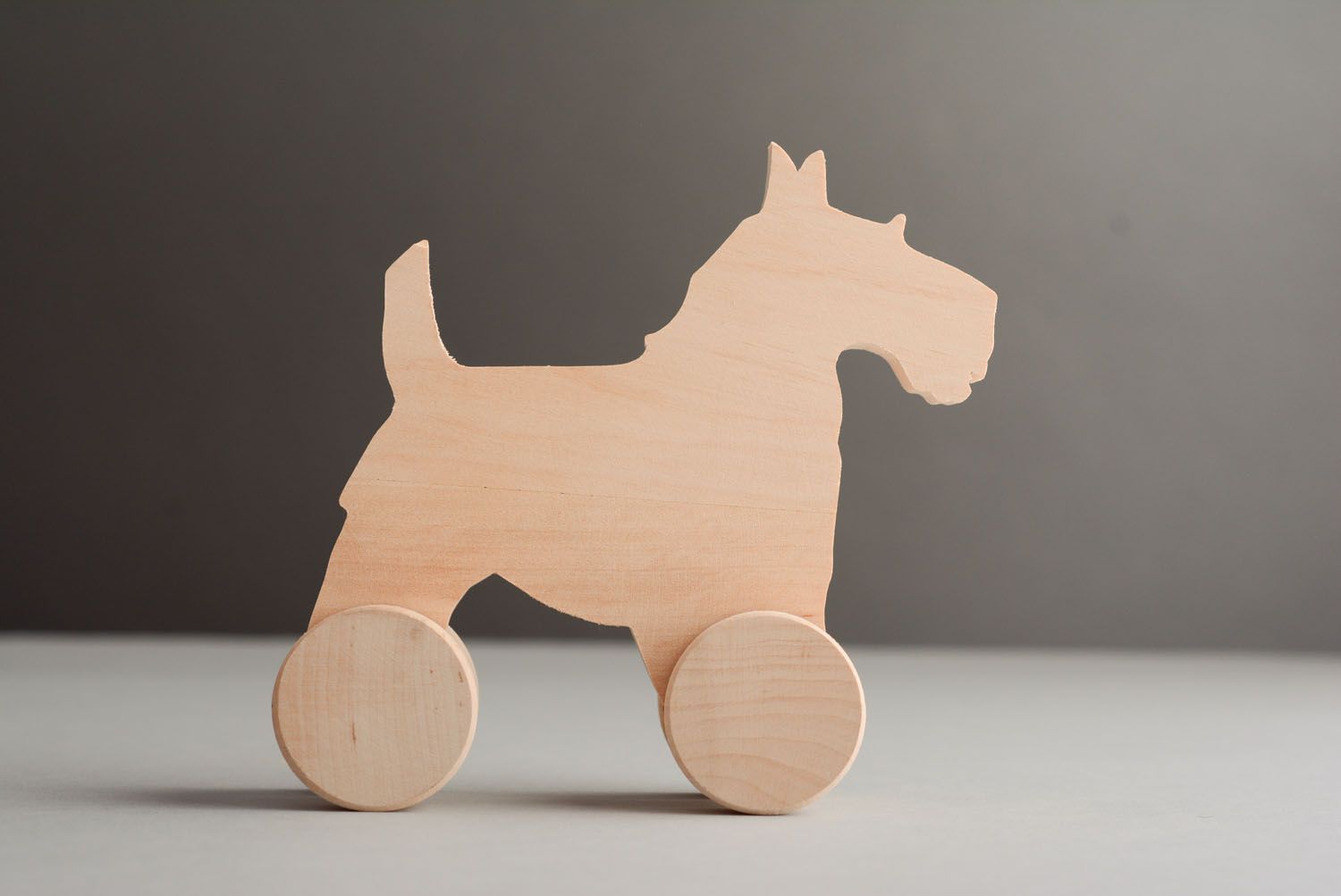 Wooden toy with wheels Doggie photo 1