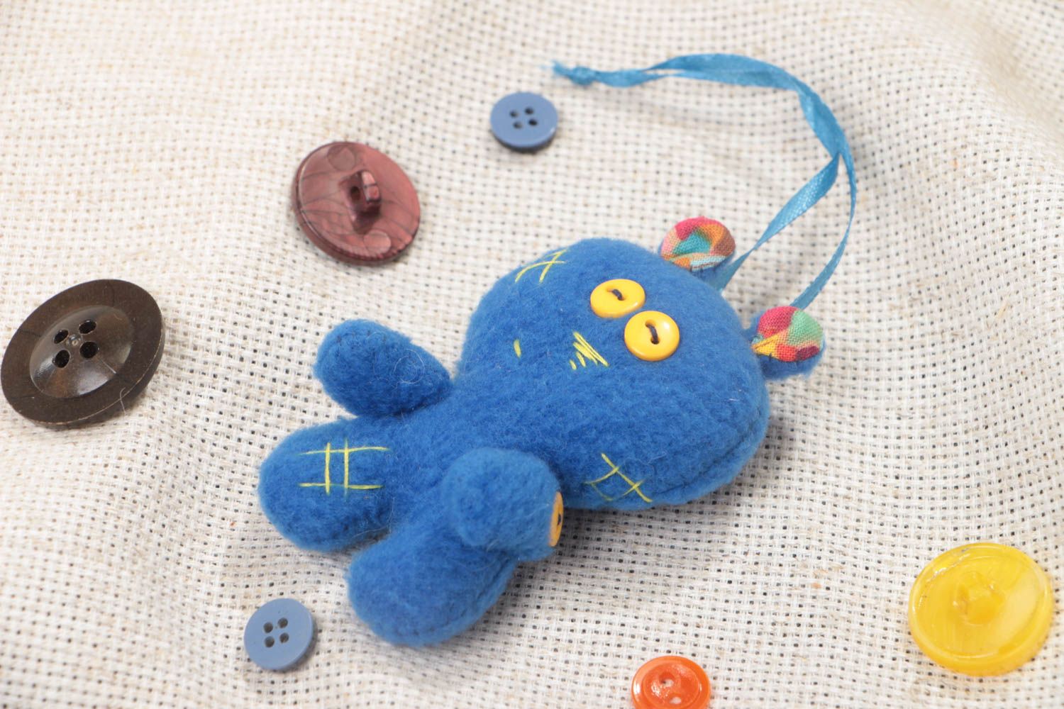 Handmade small soft toy sewn of blue fleece fabric man with eyelet   photo 1