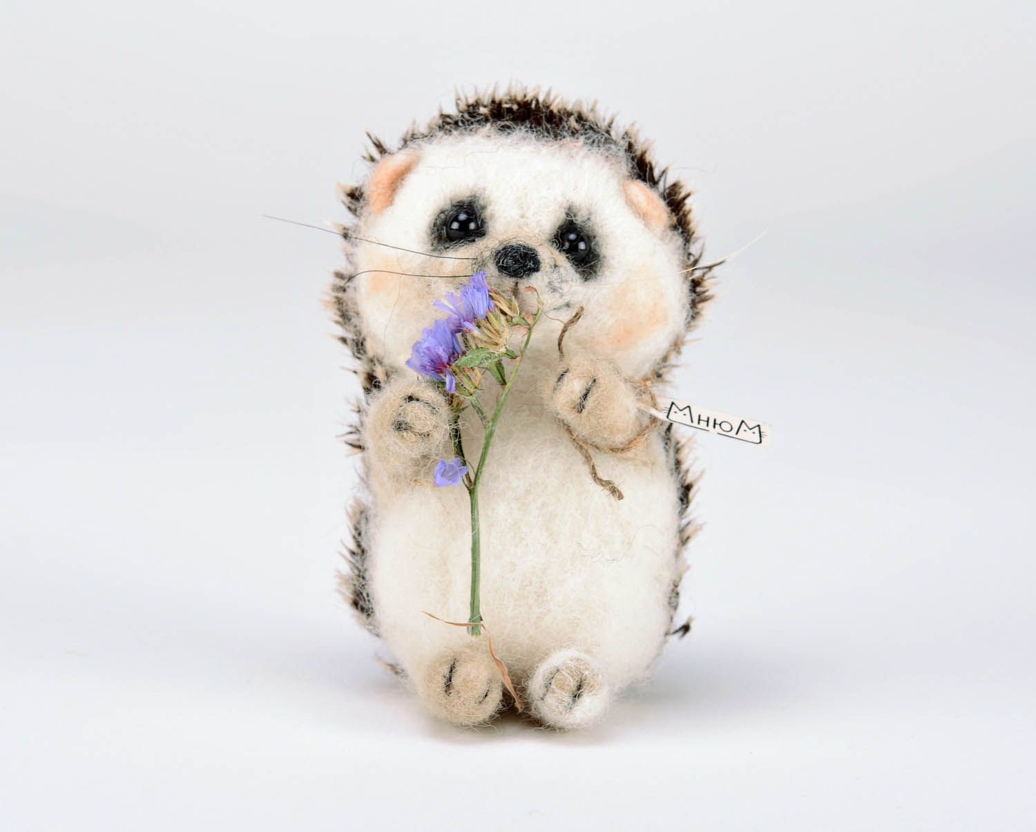 Toy made of felting wool Hedgehog with flower photo 4
