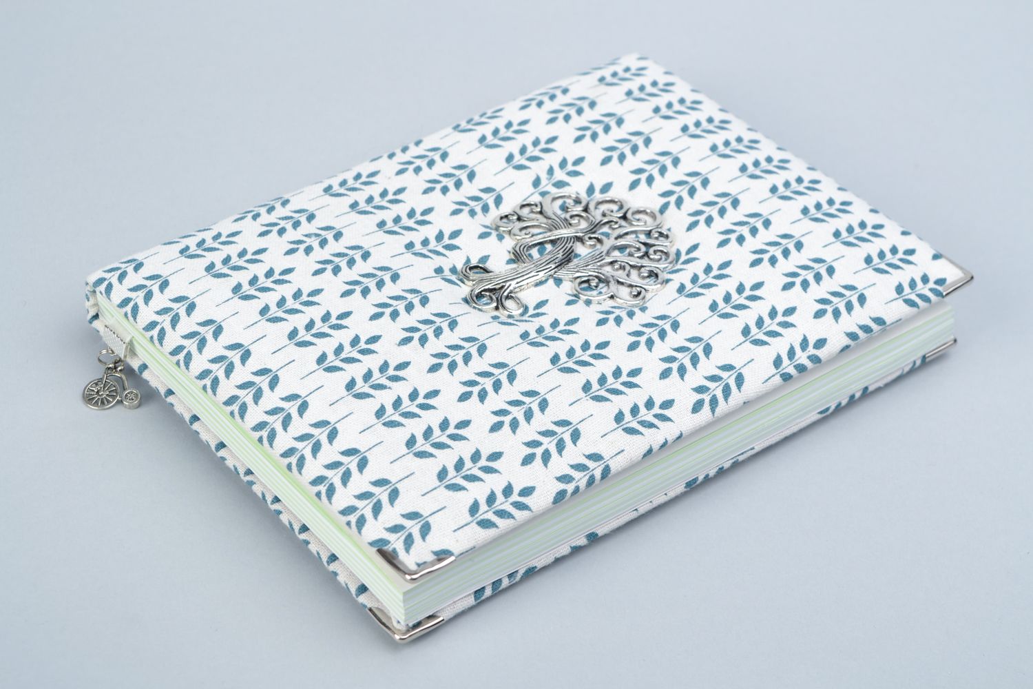 Notebook with fabric cover and metal element in the shape of a tree photo 1