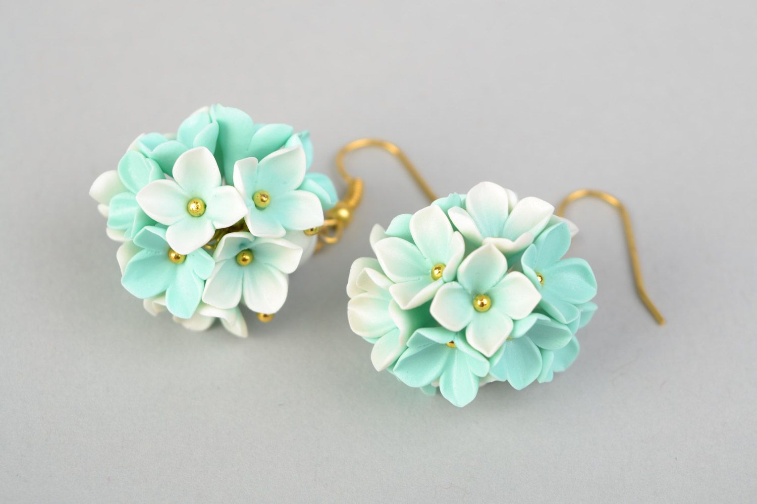 Tender homemade small earrings with polymer clay flowers of mint color shade photo 5