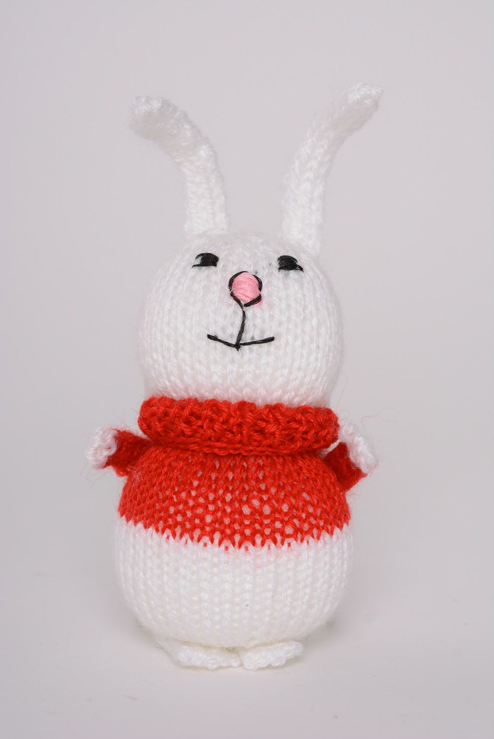 Small handmade knitted soft toy white hare in red sweater photo 1