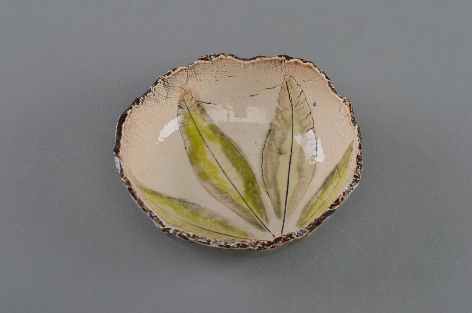 Handmade decorative small porcelain bowl with ragged edges with floral painting photo 2