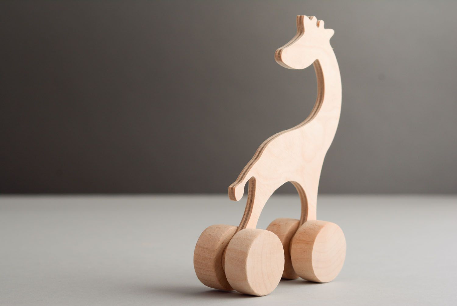 Деревянная игрушка в виде жирафа фото 4