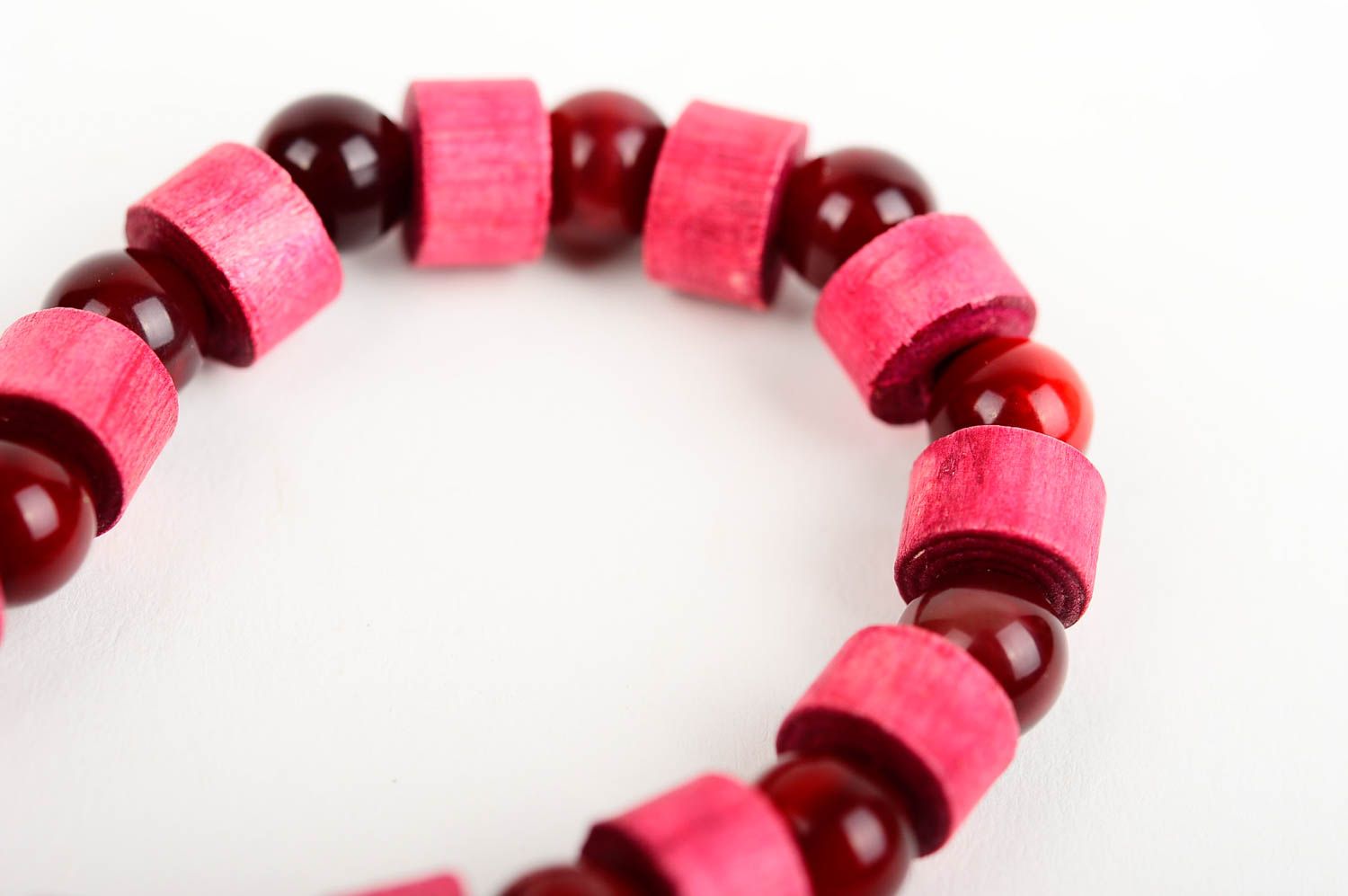 The wide wooden handmade beaded bracelet with dark red and light red beads on elastic cord photo 5