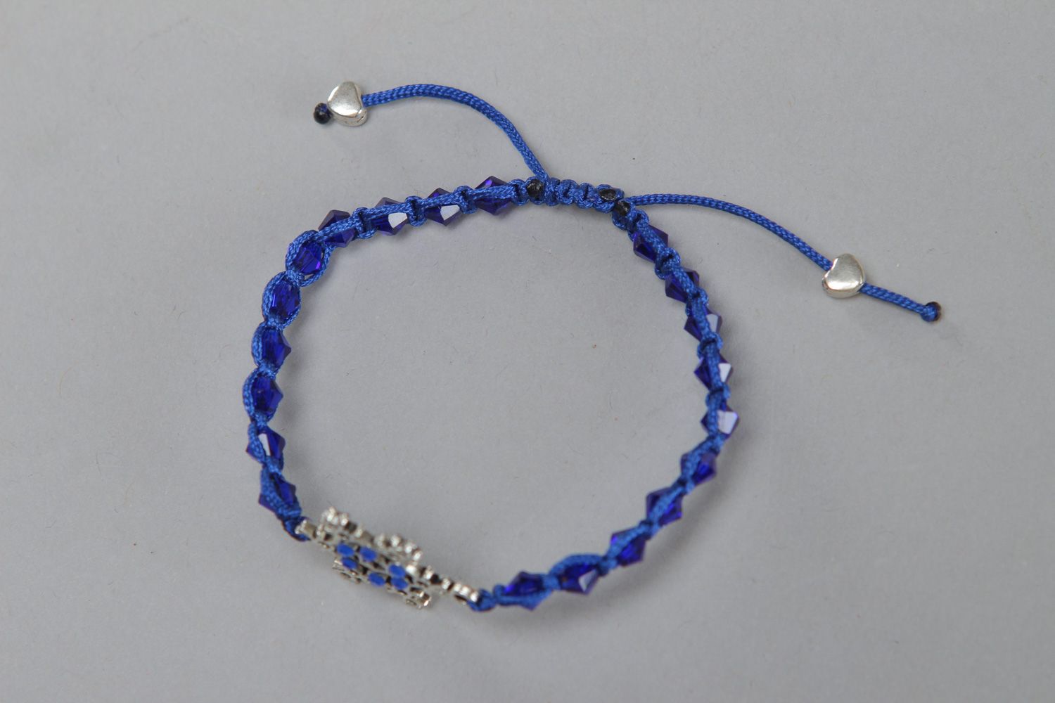 Handmade friendship bracelet woven of cord with crystal beads and metal snowflake photo 2