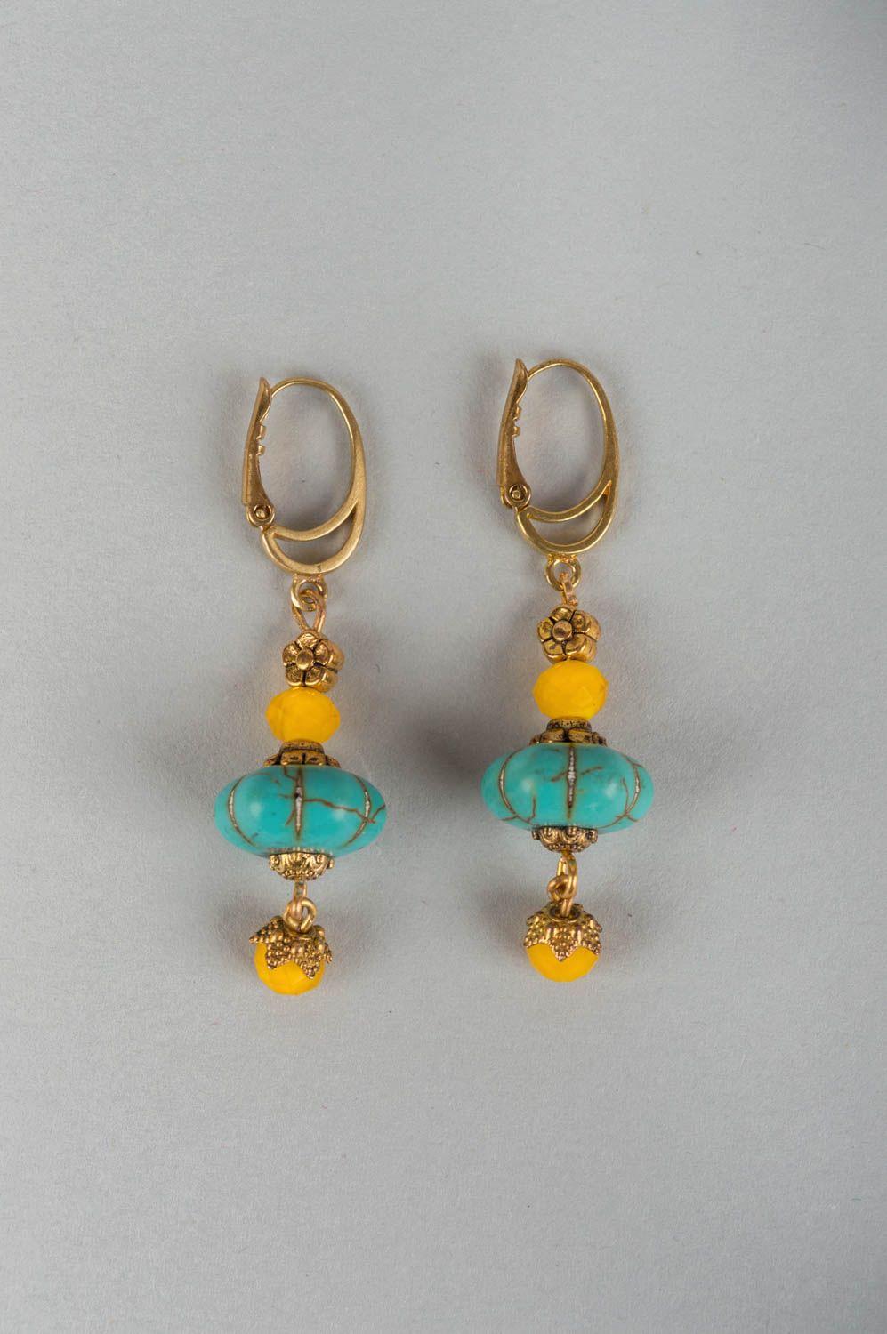 Beautiful handmade designer brass earrings with natural turquoise stone photo 2