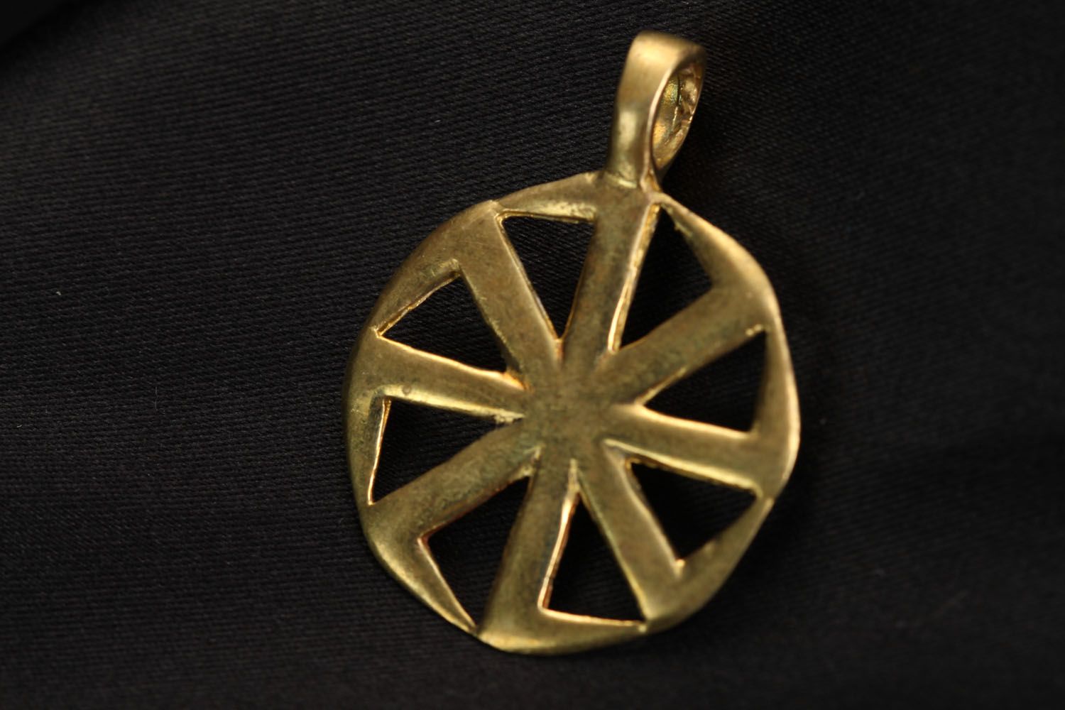 Bronze pendant on a chain Kolovrat photo 1