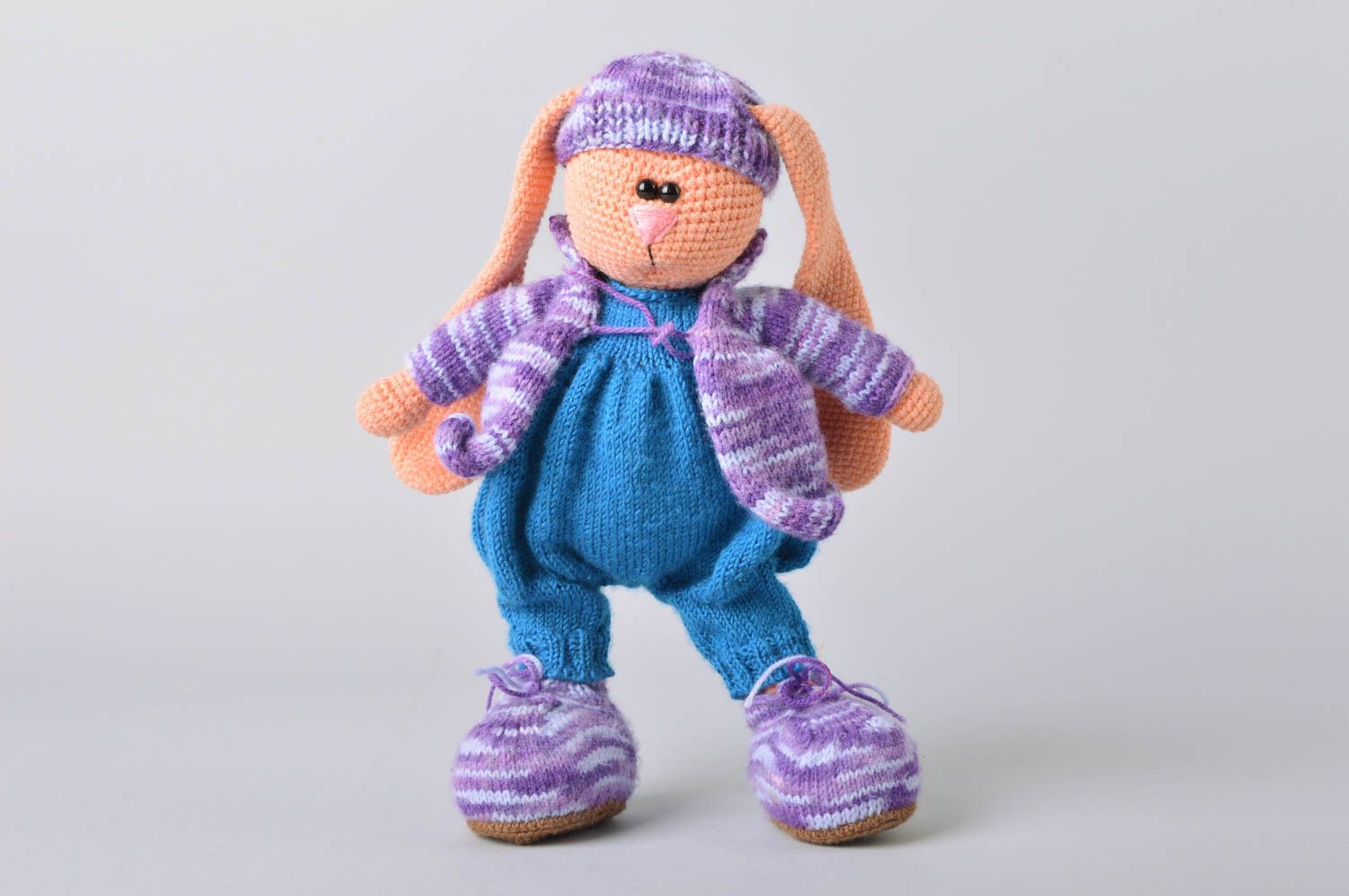 Handmade crocheted soft toy rabbit in blue knit clothing for children photo 2