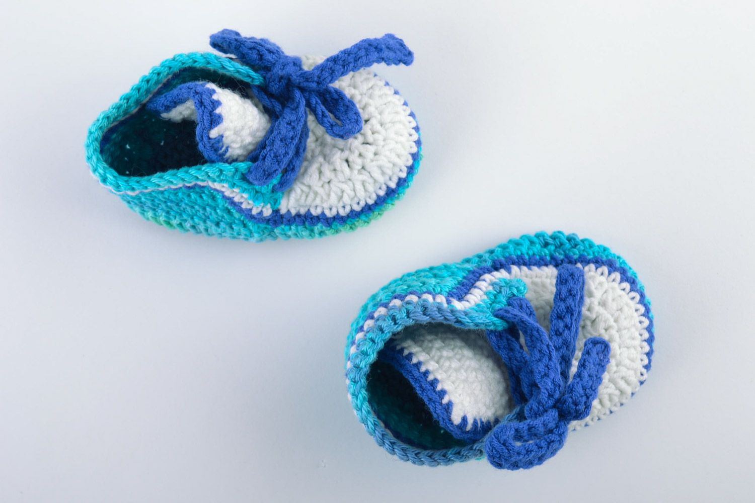 Handmade knitted wool baby booties in blue color palette photo 4