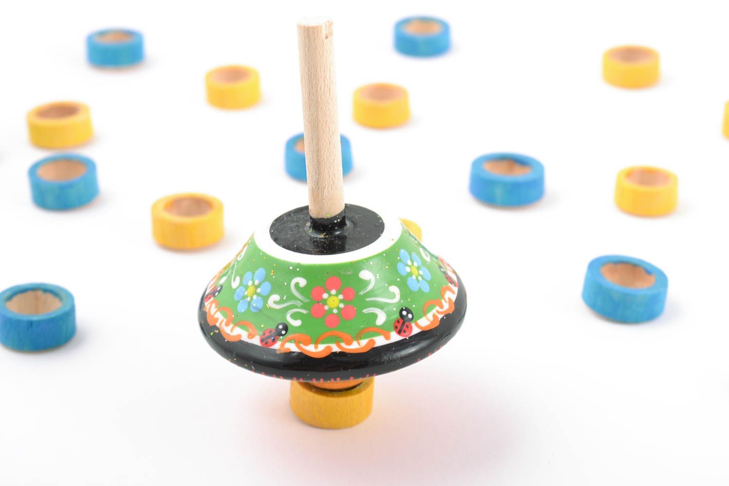 Beautiful bright painted handmade wooden toy spinning top for children photo 1
