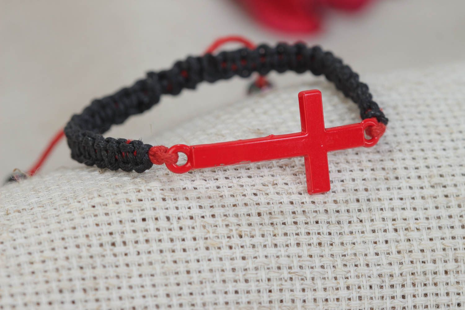 Unusual handmade black woven friendship bracelet with cross charm photo 1