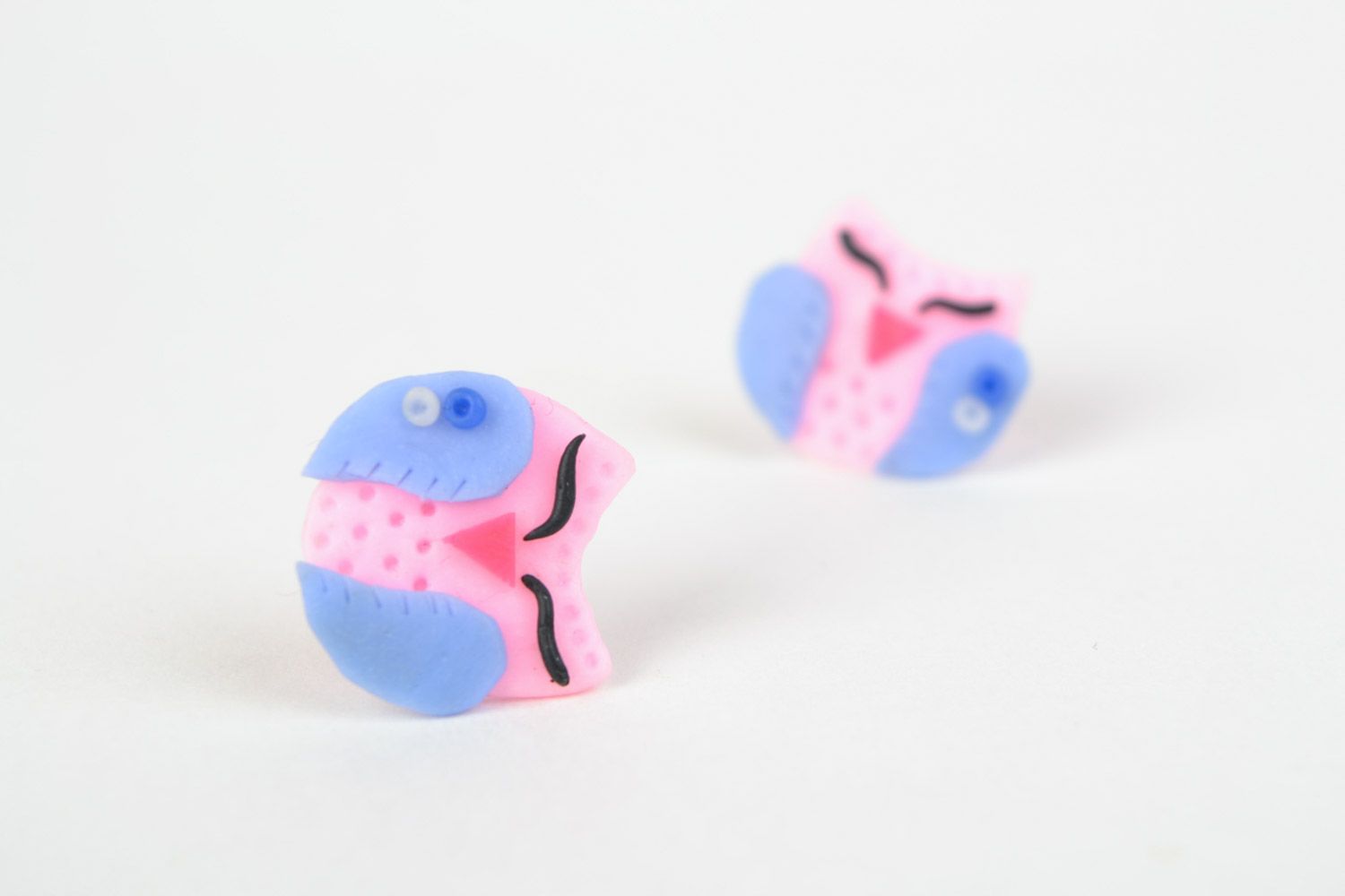Small handmade polymer clay stud earrings in the shape of pink and blue owls photo 1