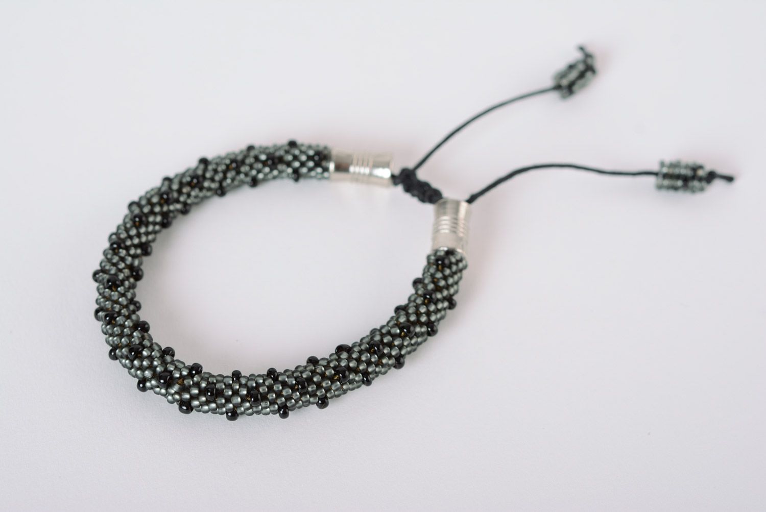 Handmade black beaded cord wrist bracelet with ties photo 1