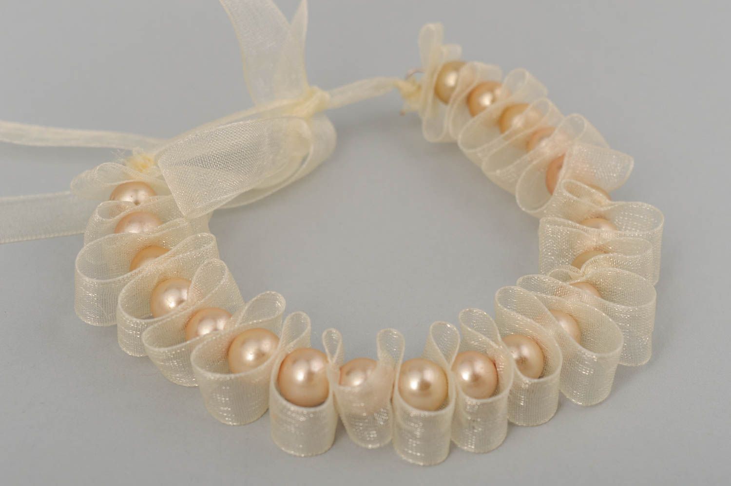 Handmade festive necklace with ceramic pearls on transparent organza ribbon photo 2