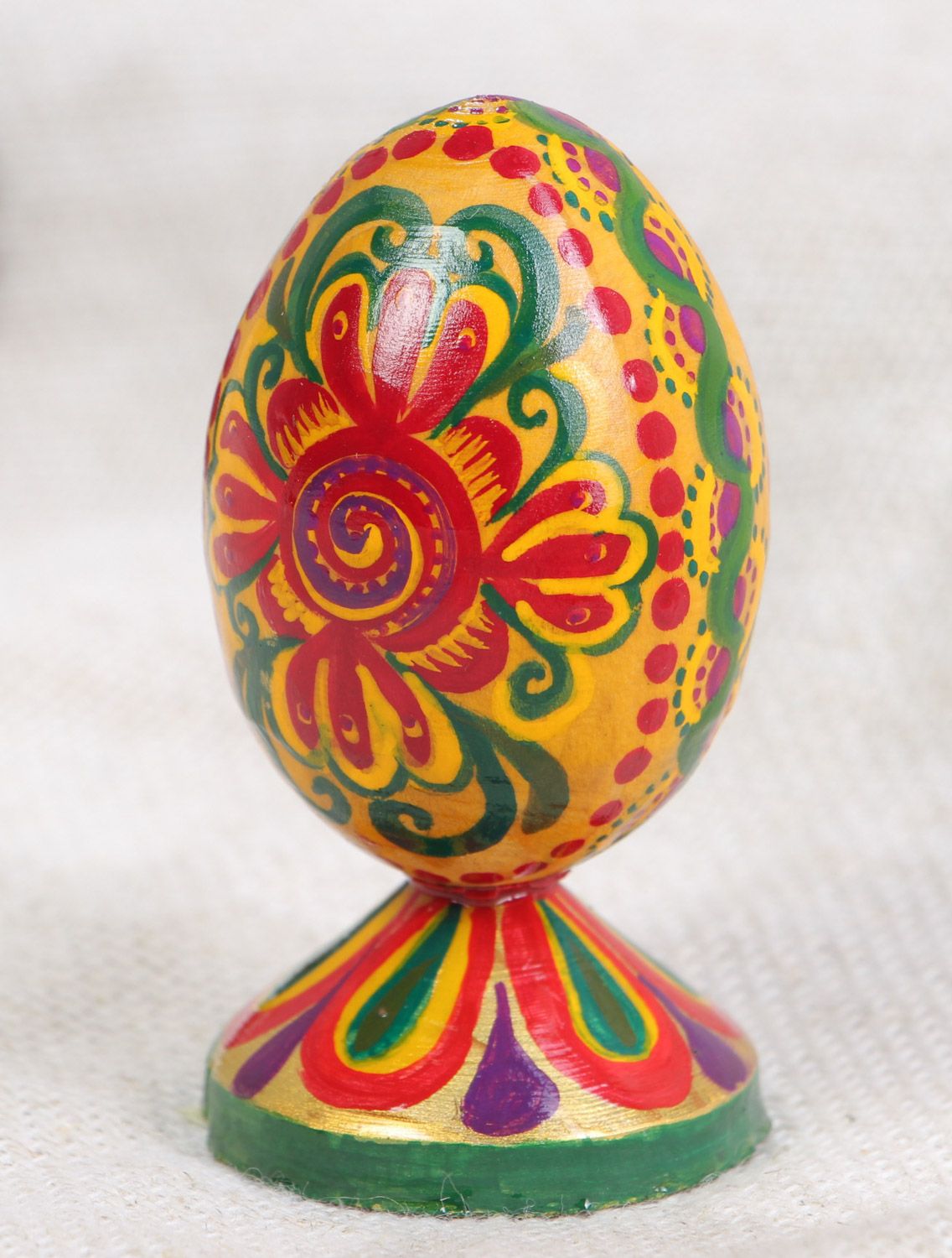 Handmade painted wooden decorative Easter egg on stand interior decor photo 1